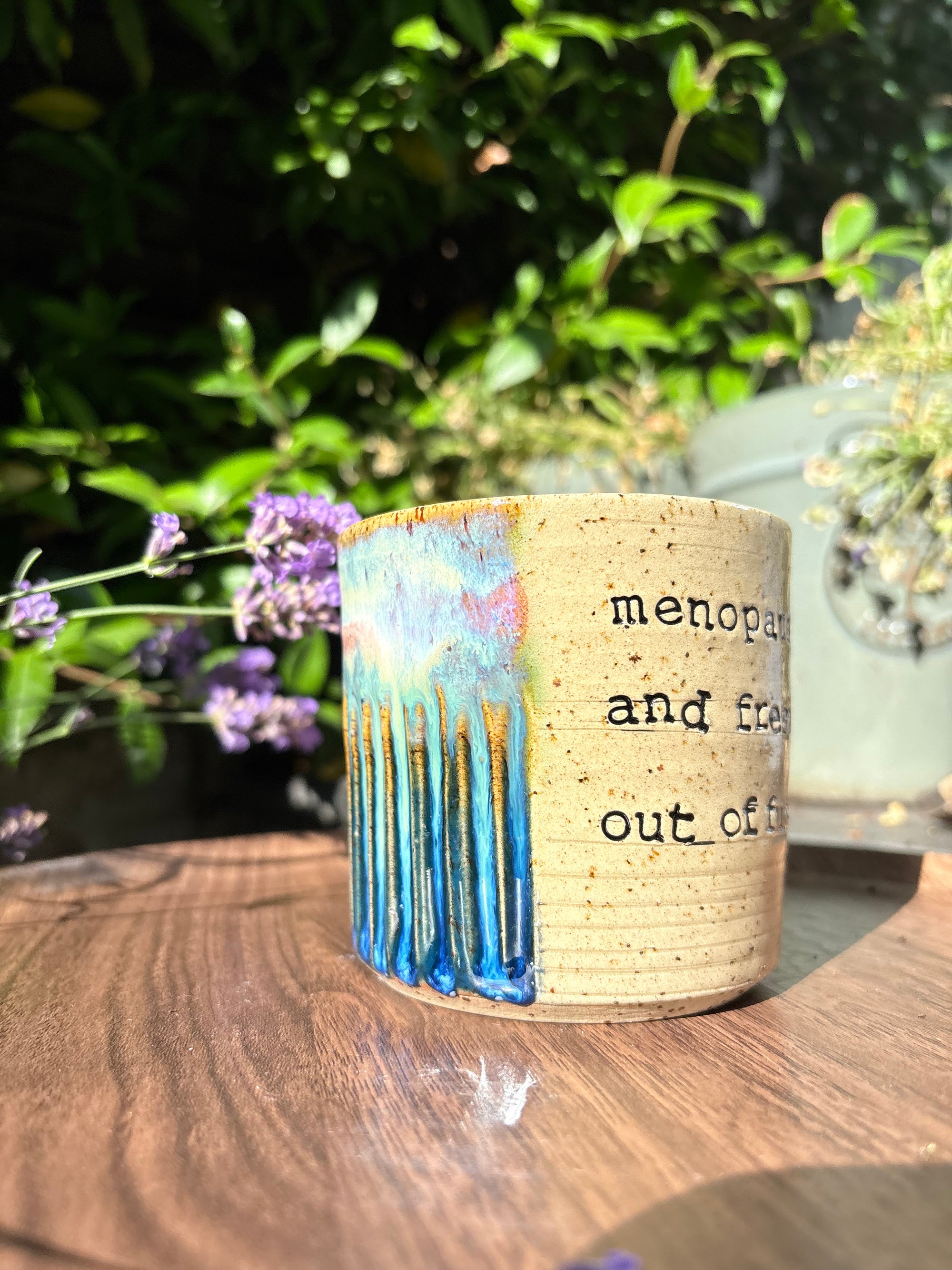 "menopausal and fresh out of fucks" mug (green/blue)