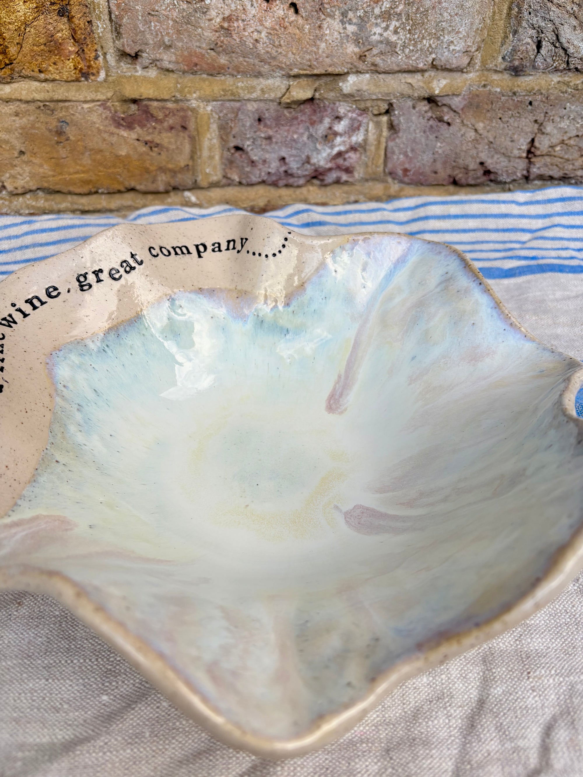 "good food, fine wine, great company..." serving dish