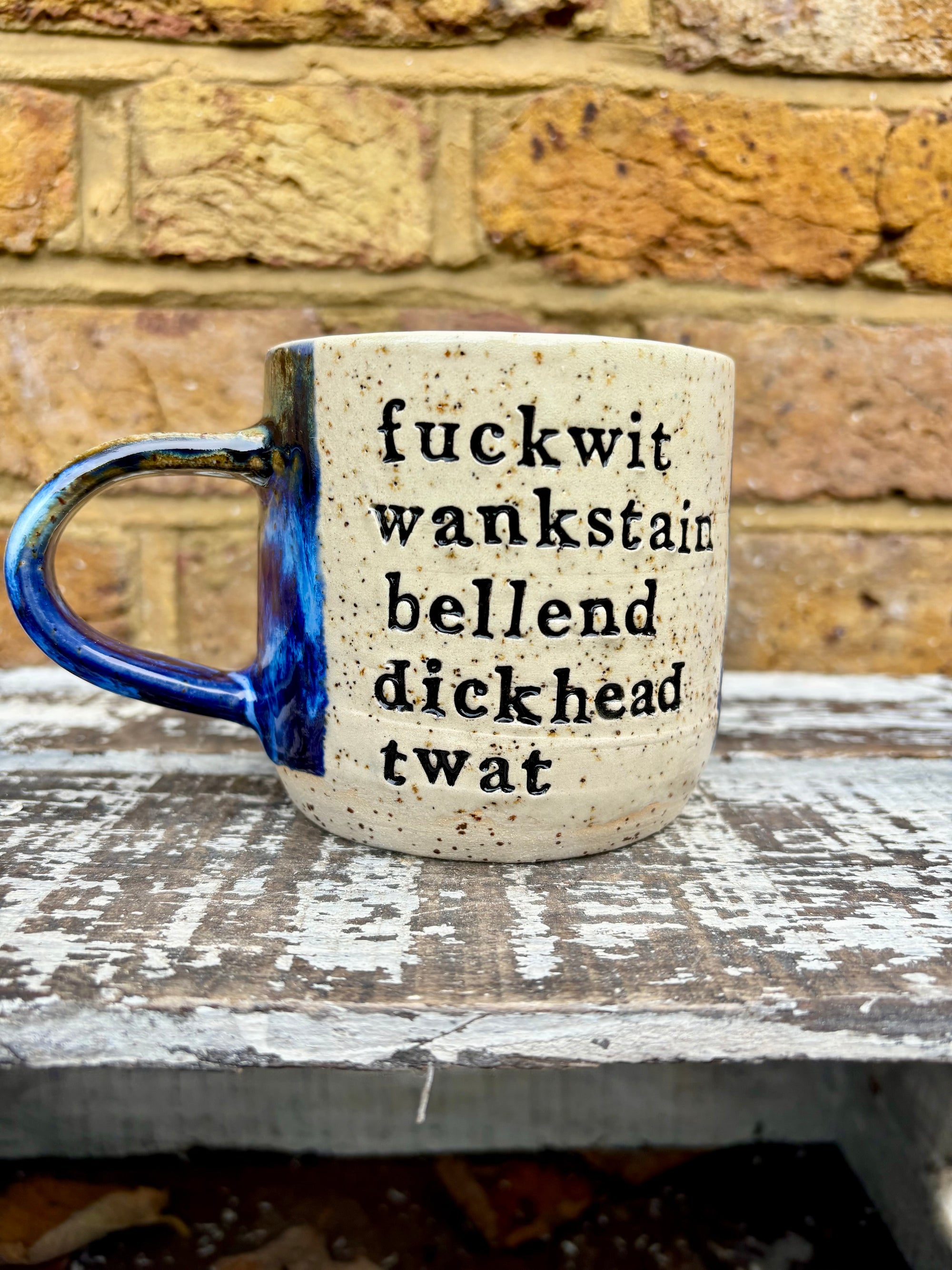 "bellend fuckwit dickwad dipshit wanker" mug (Antique Blues)
