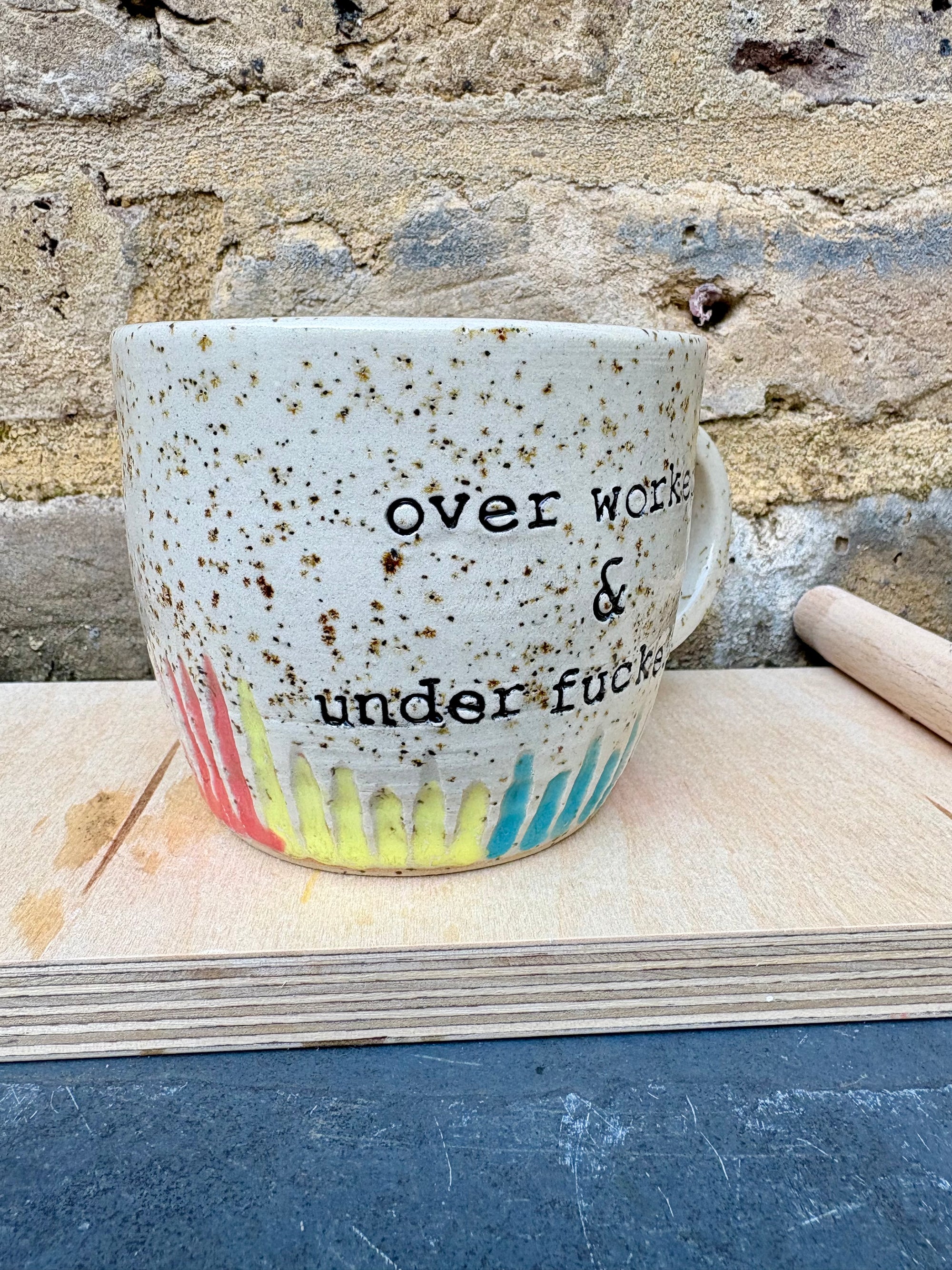 overworked and underfucked mug (multicoloured rainbow grooves)