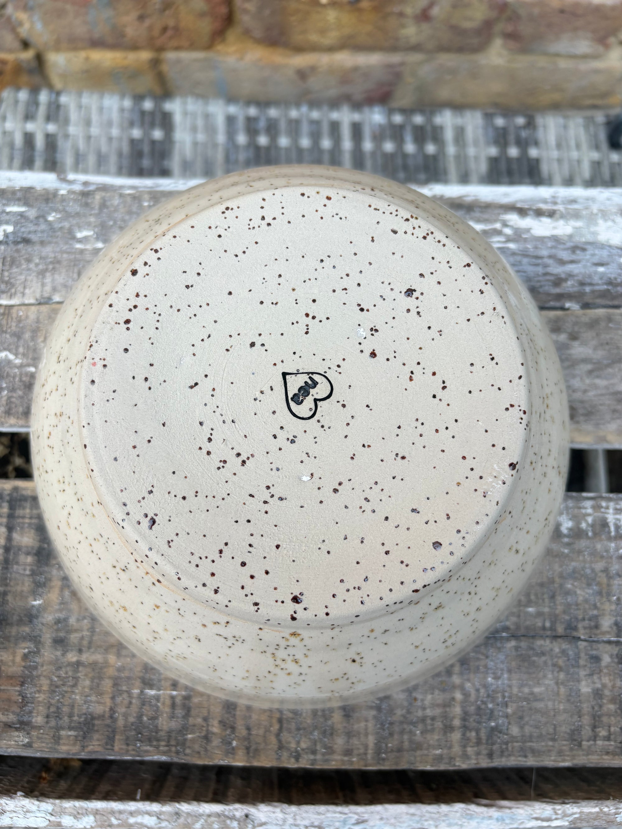“eat, drink and fuck off by 9pm"  deep round salad/pasta bowl (pink, flecked clay)
