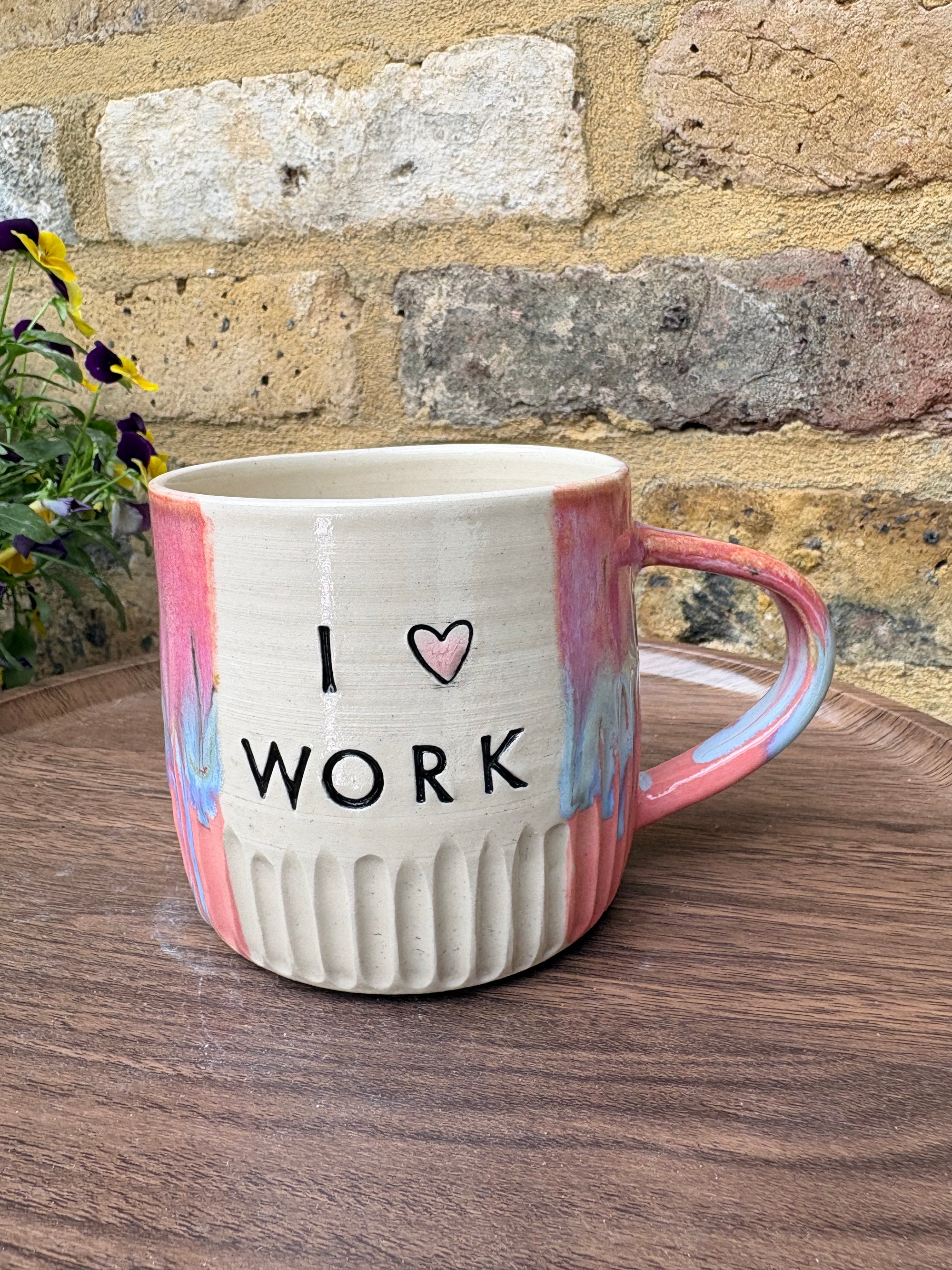 "I 🩷 WORK” "everyone in this place is a cunt" mug (pinks, left)