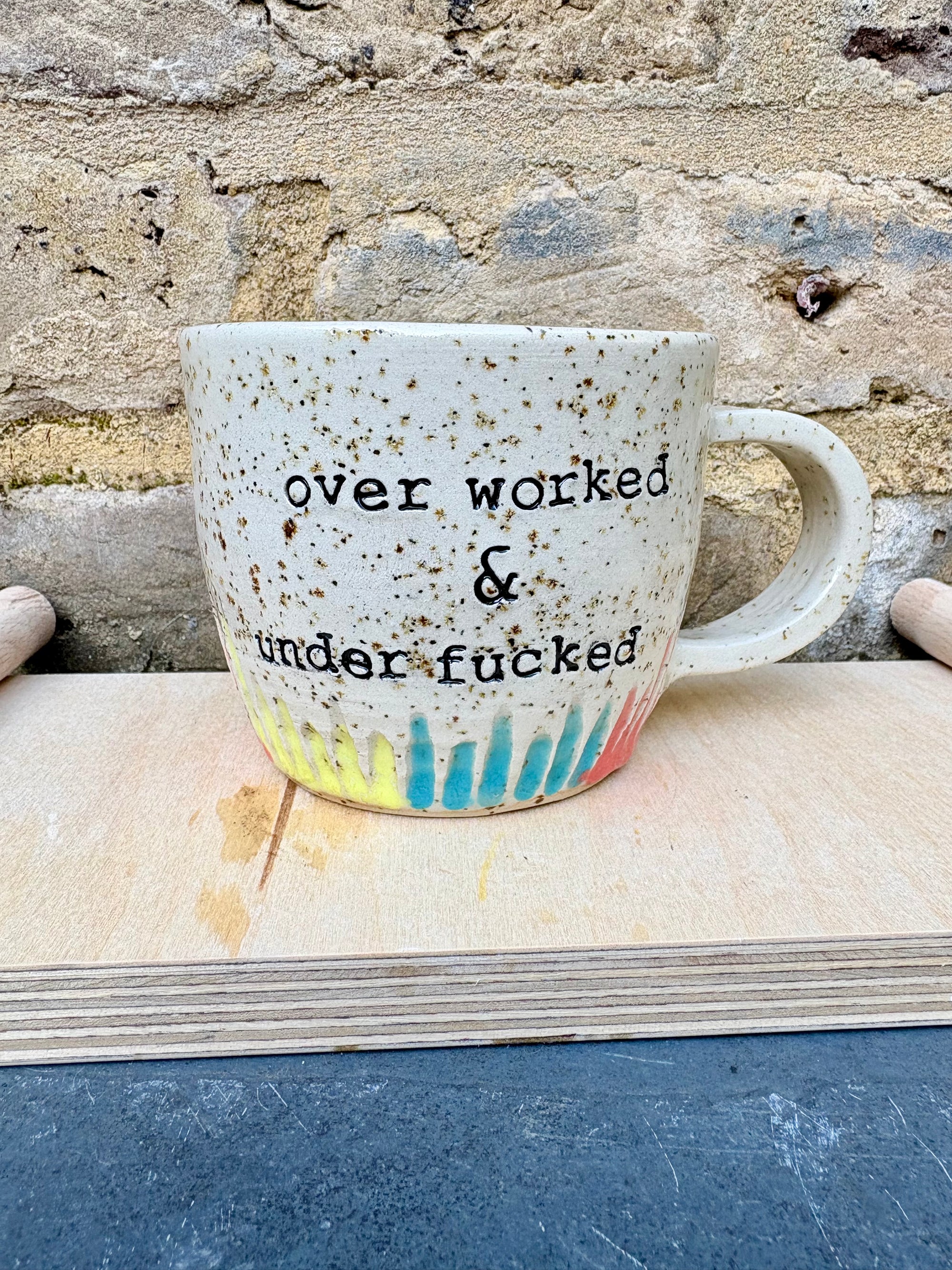 overworked and underfucked mug (multicoloured rainbow grooves)