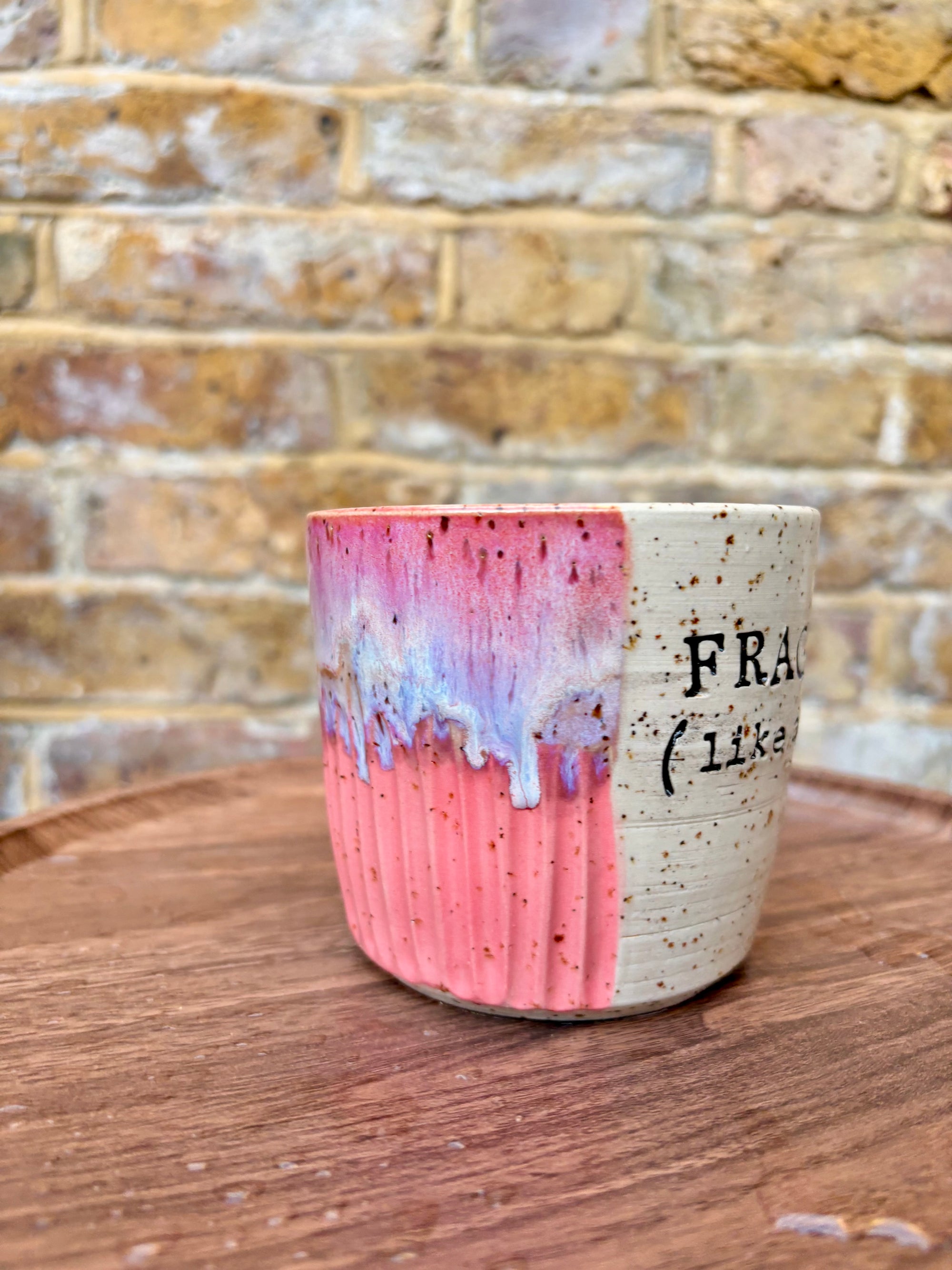 “FRAGILE (like a bomb) mug (pink, black text)