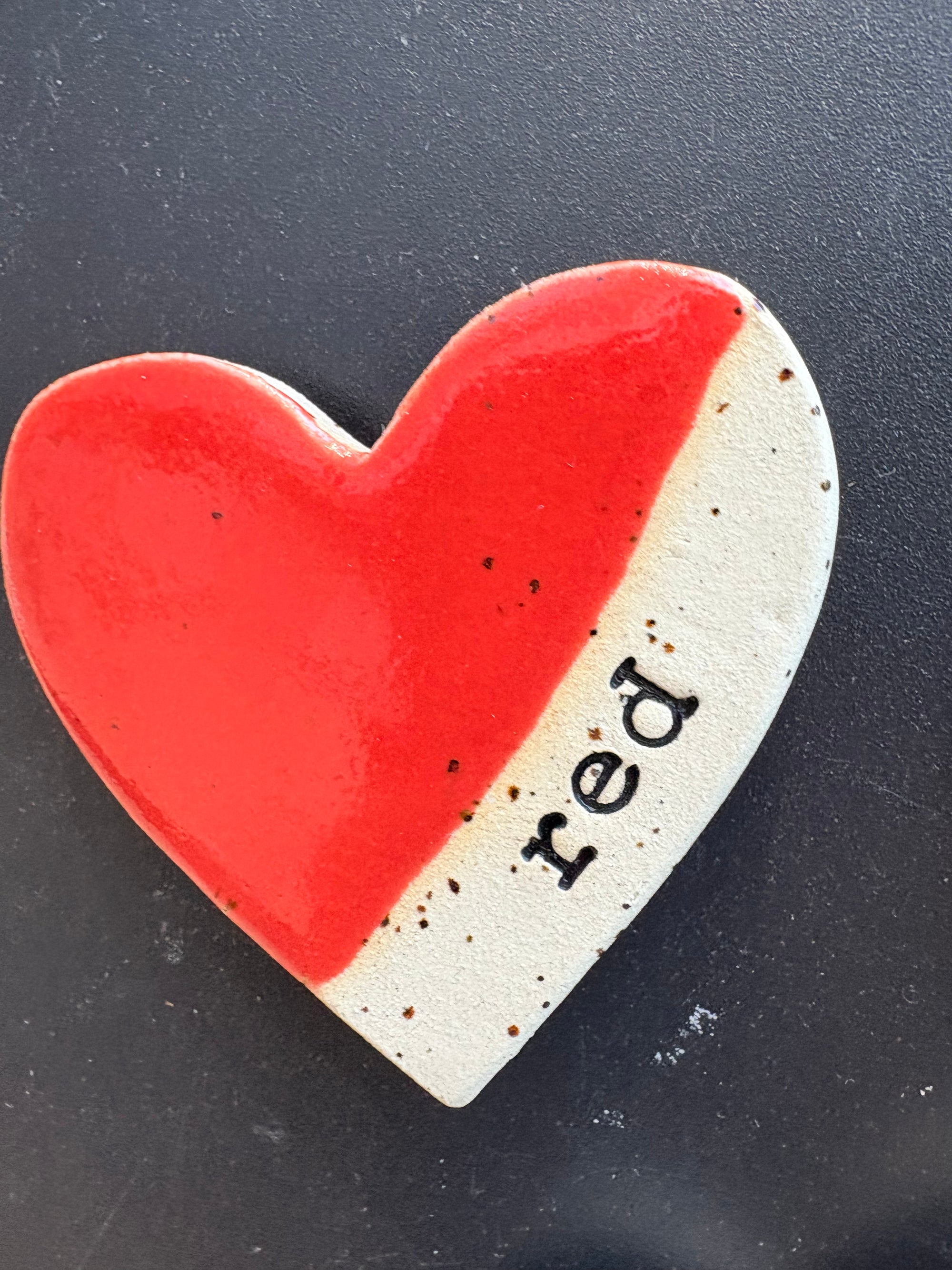 Twelve heart shaped Taylor Swift album magnets
