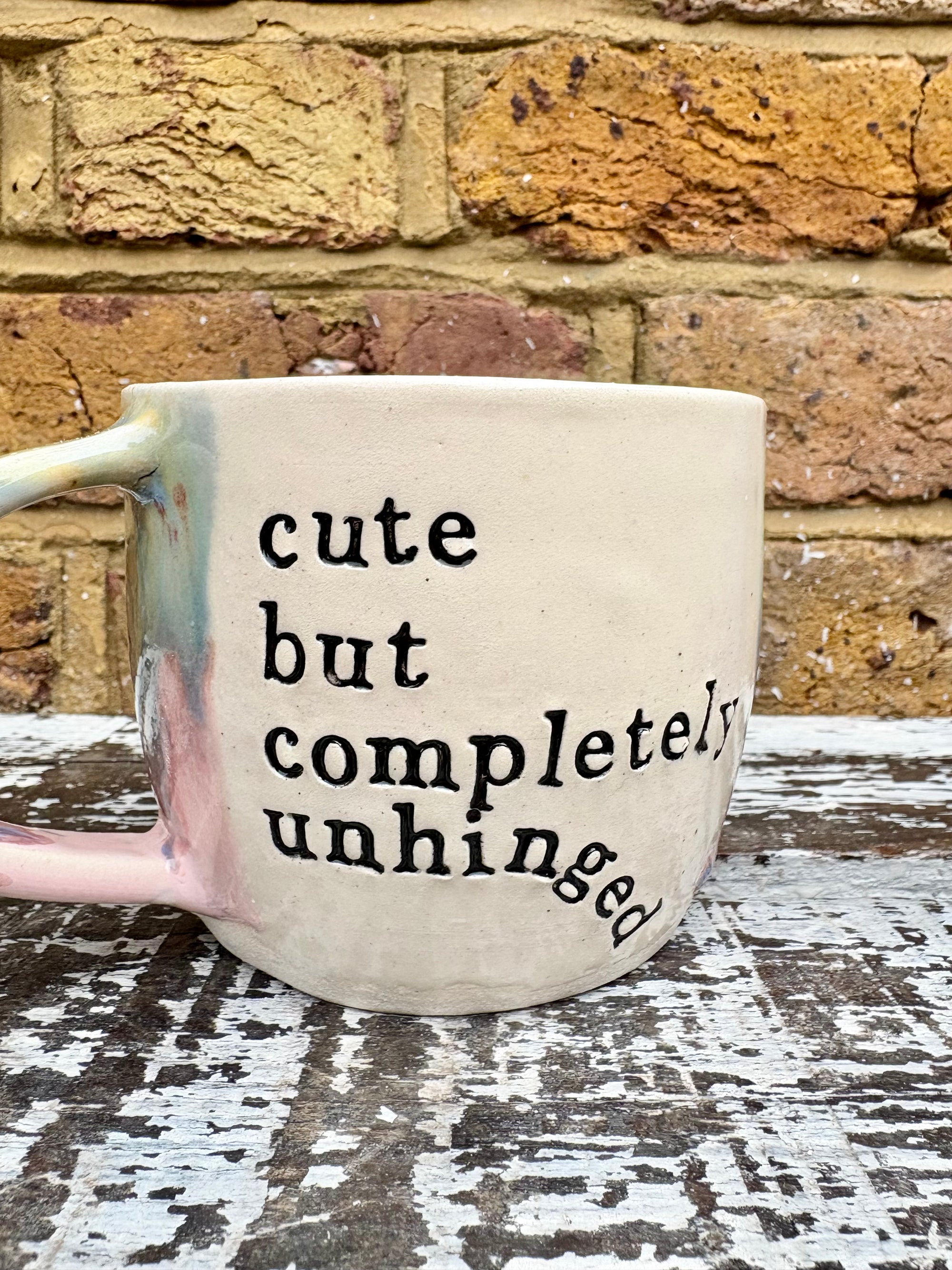 "cute but completely unhinged" mug