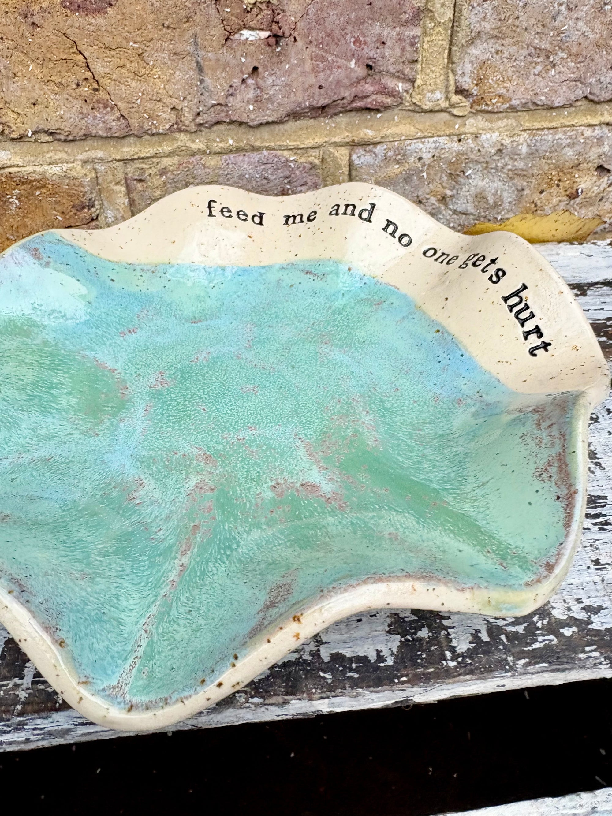 "feed me and no one gets hurt"  serving dish