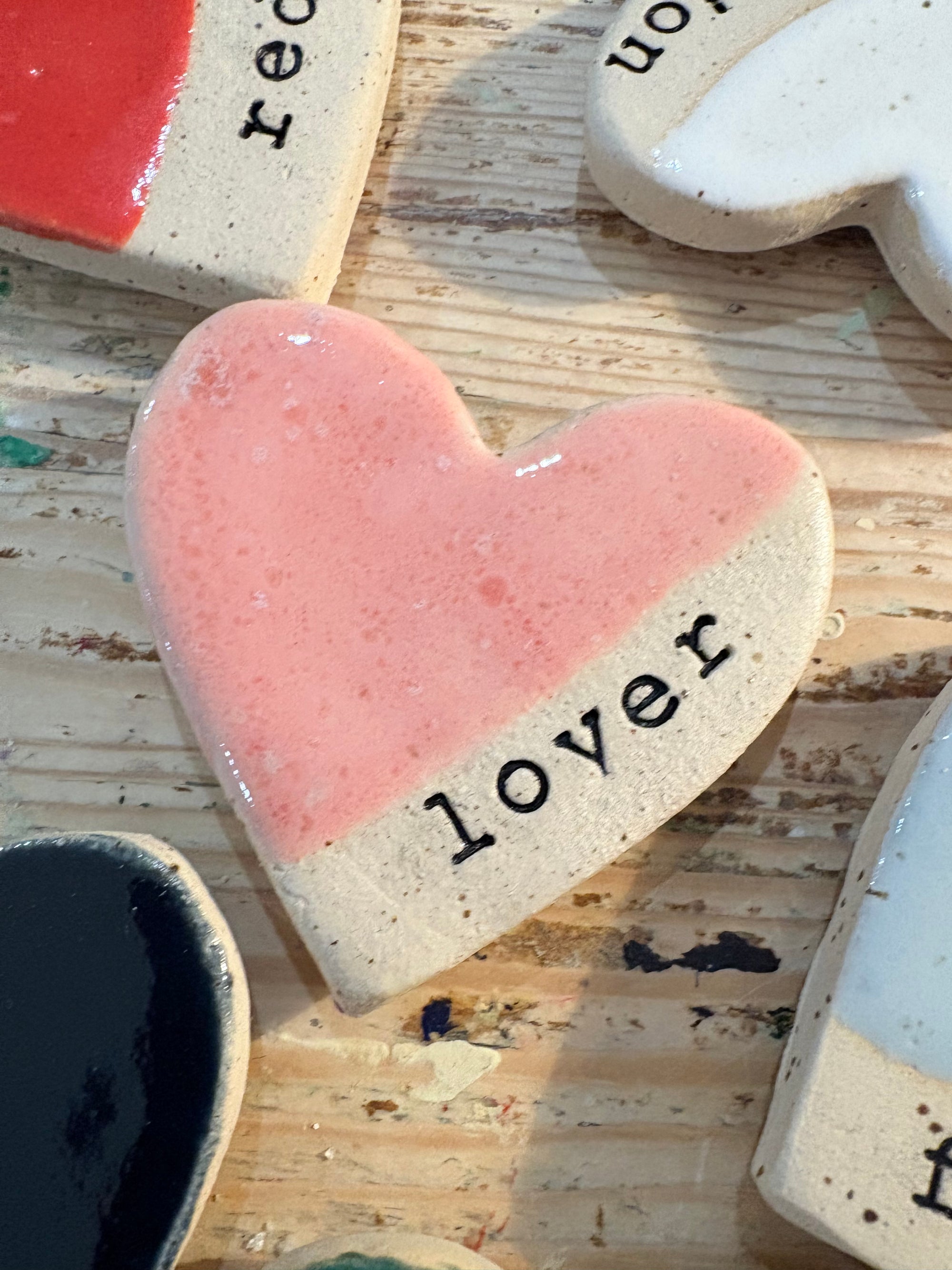 Twelve heart shaped Taylor Swift album magnets