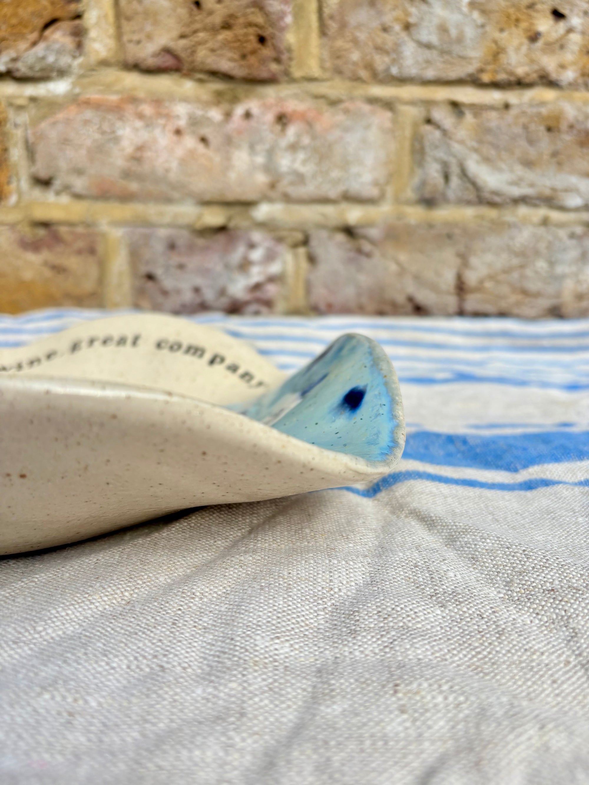 "good food, fine wine, great company..." serving dish