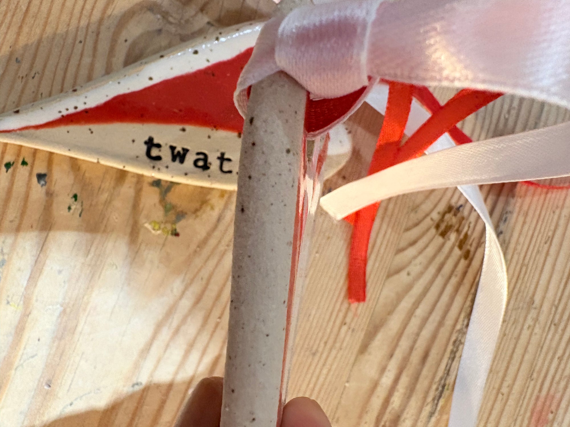 “twat” hanging decoration (red and white, large)
