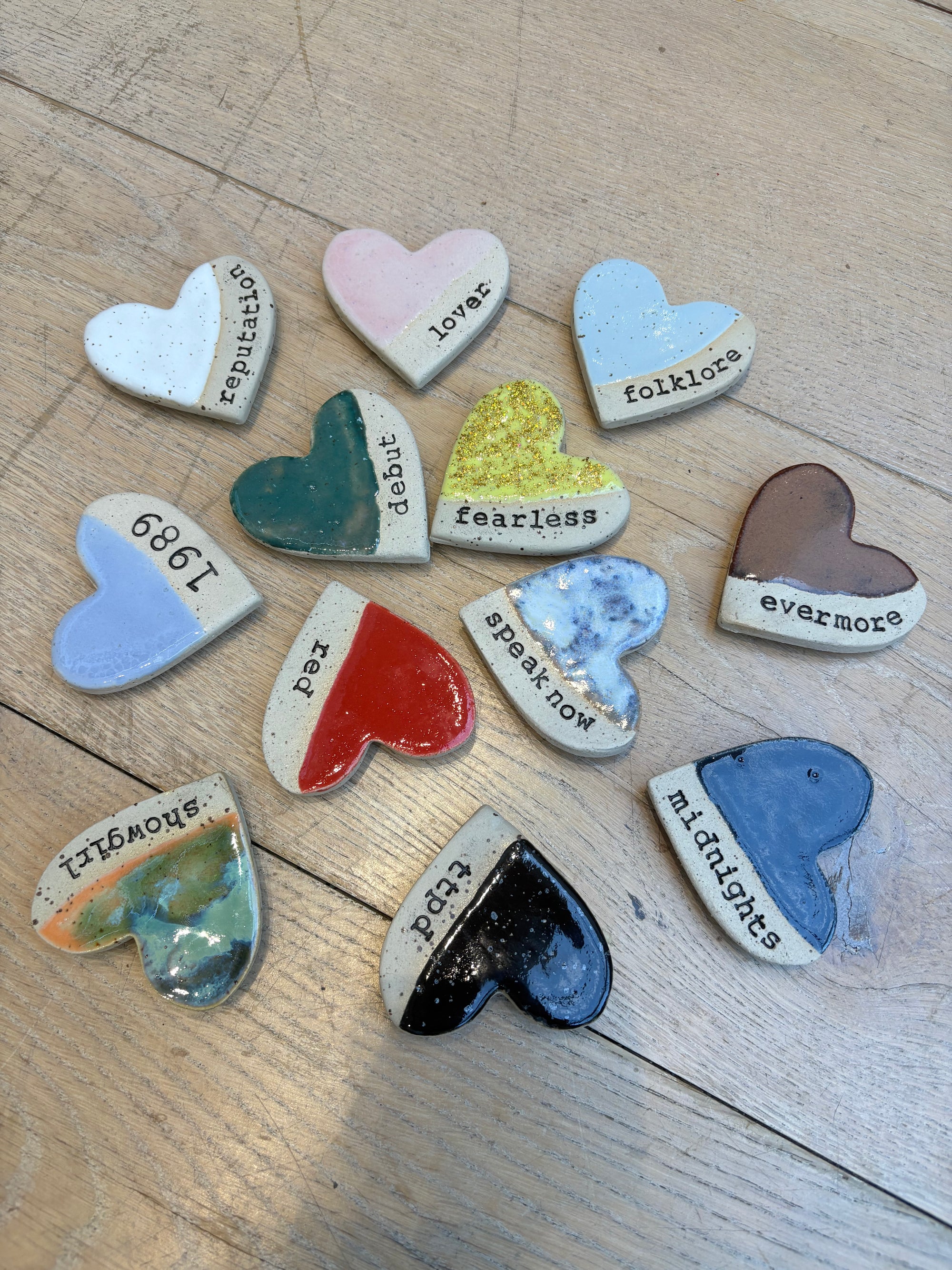 Twelve heart shaped Taylor Swift album magnets