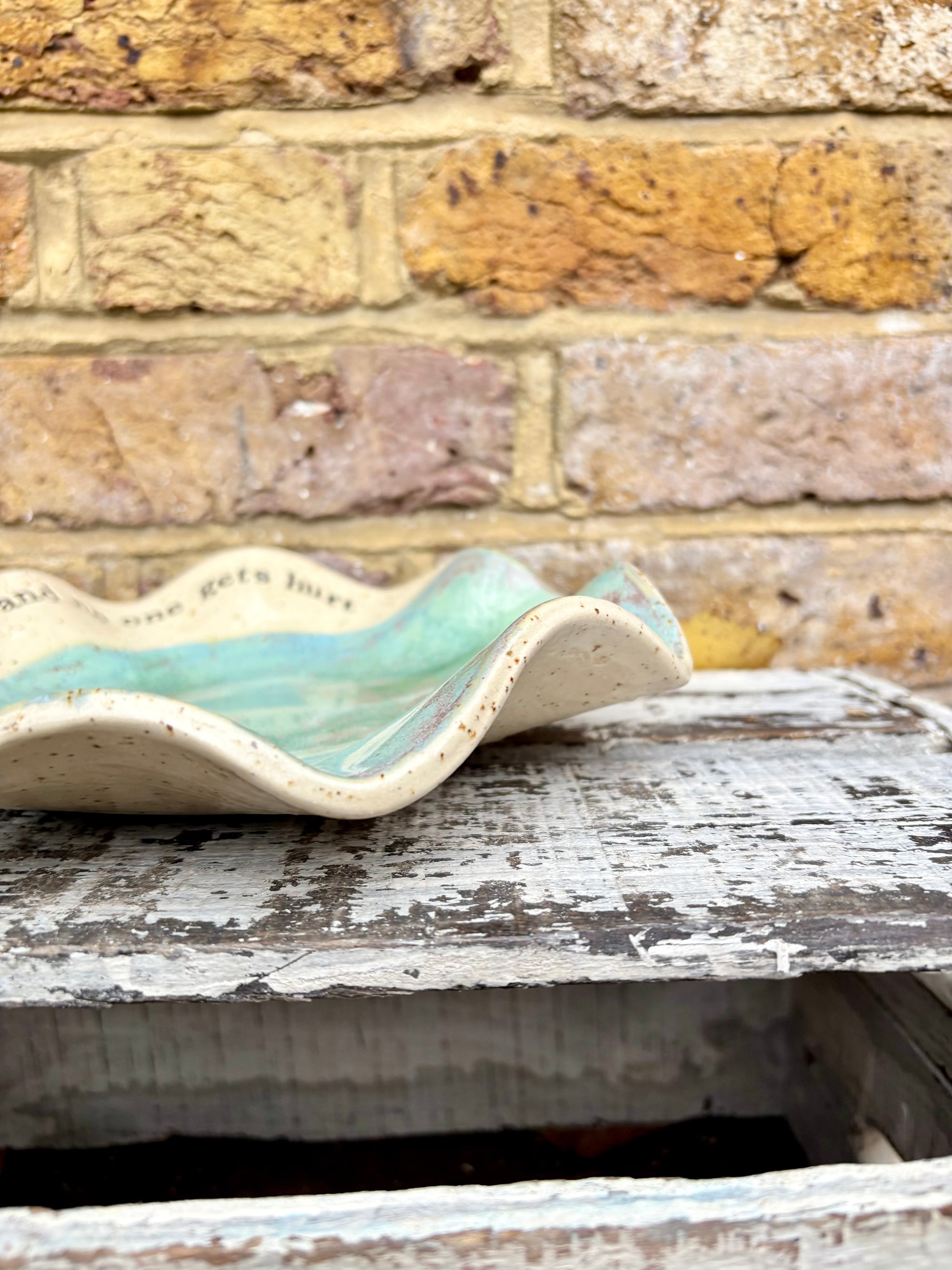 "feed me and no one gets hurt"  serving dish