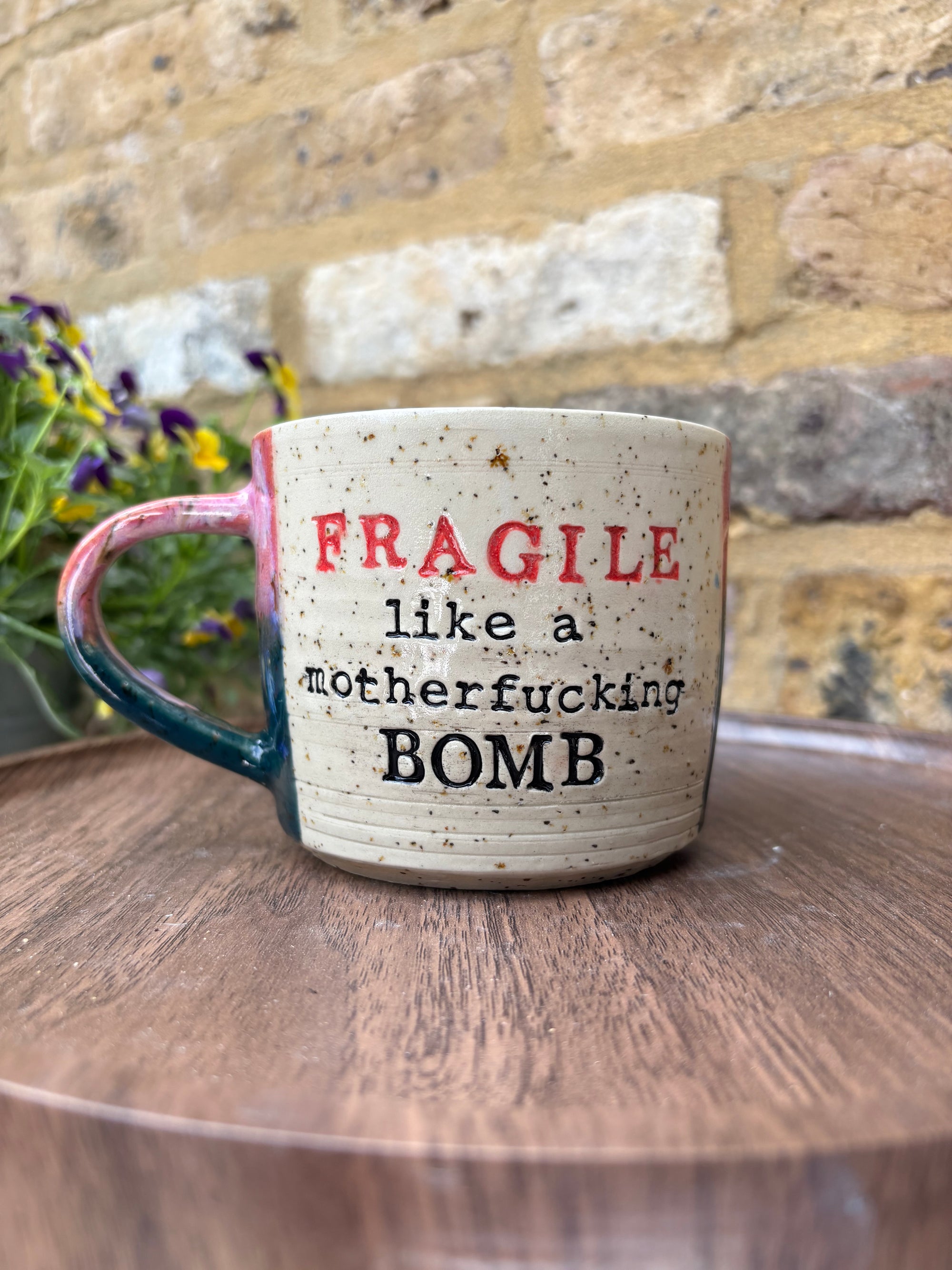 "FRAGILE like a motherfucking bomb" mug (pink/ green)