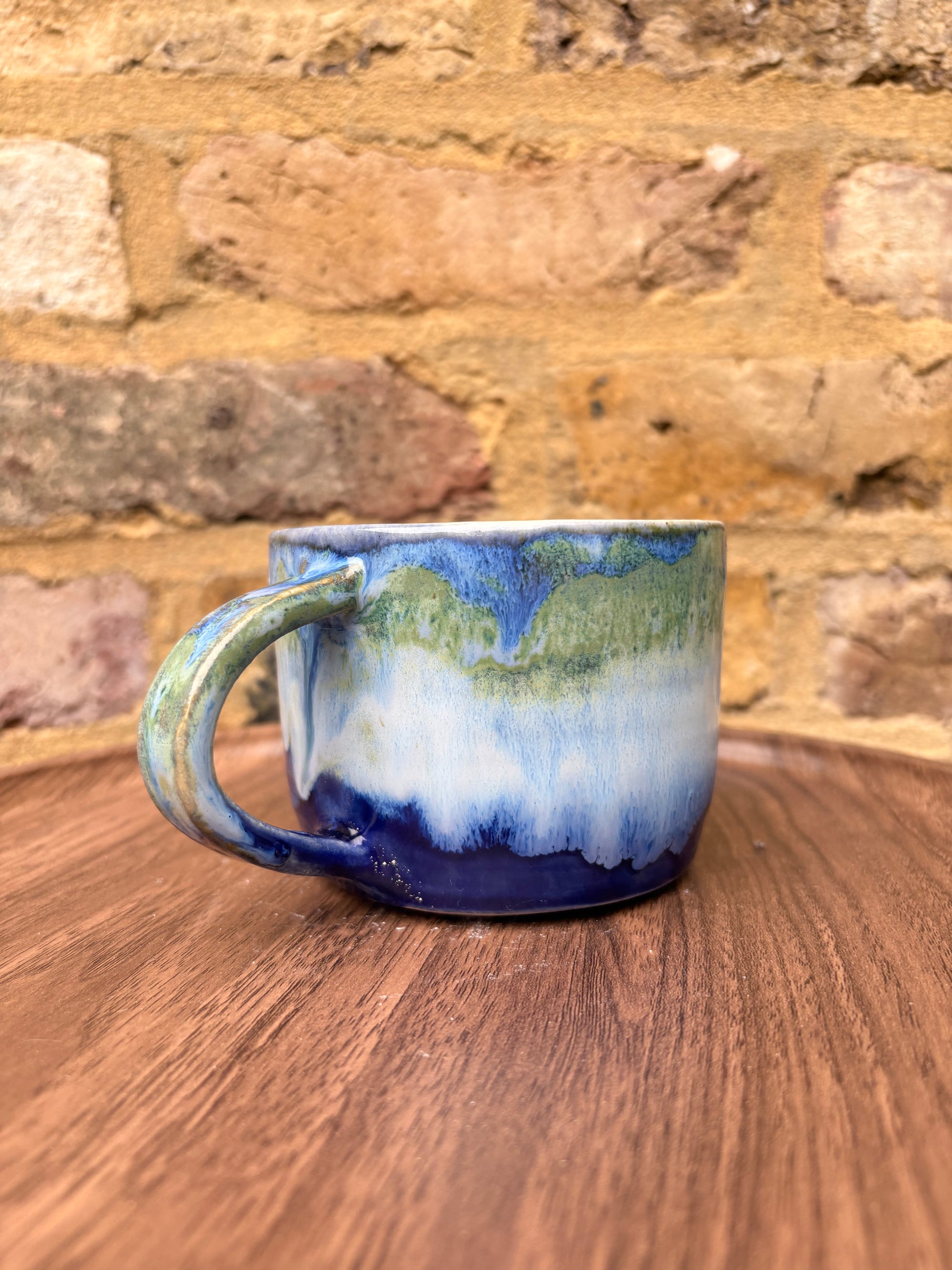 “What” “the fuck” mug (cream, blue/green)