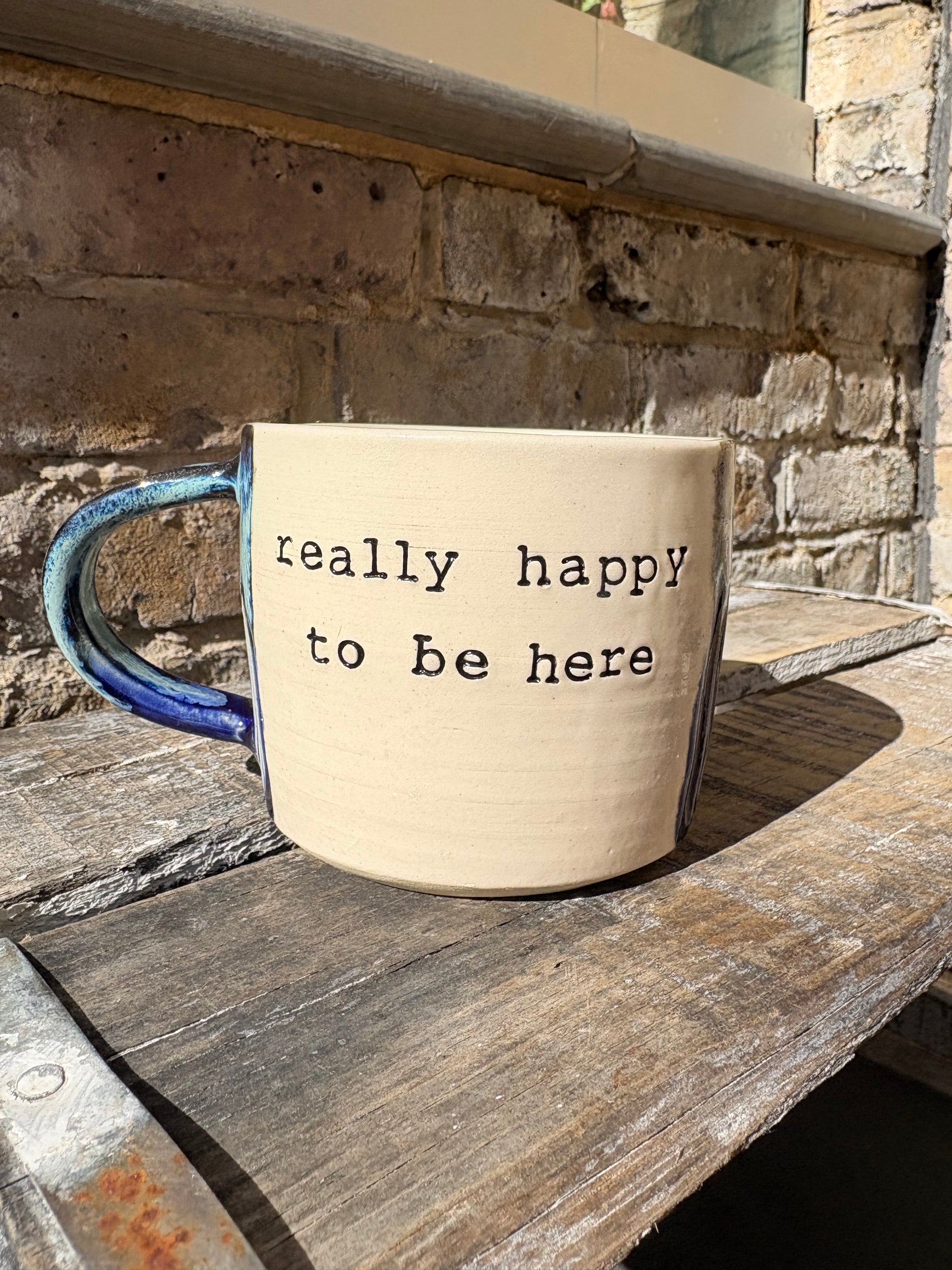 "really happy to be here” "what a bunch of cunts" mug (medium, blue shore)