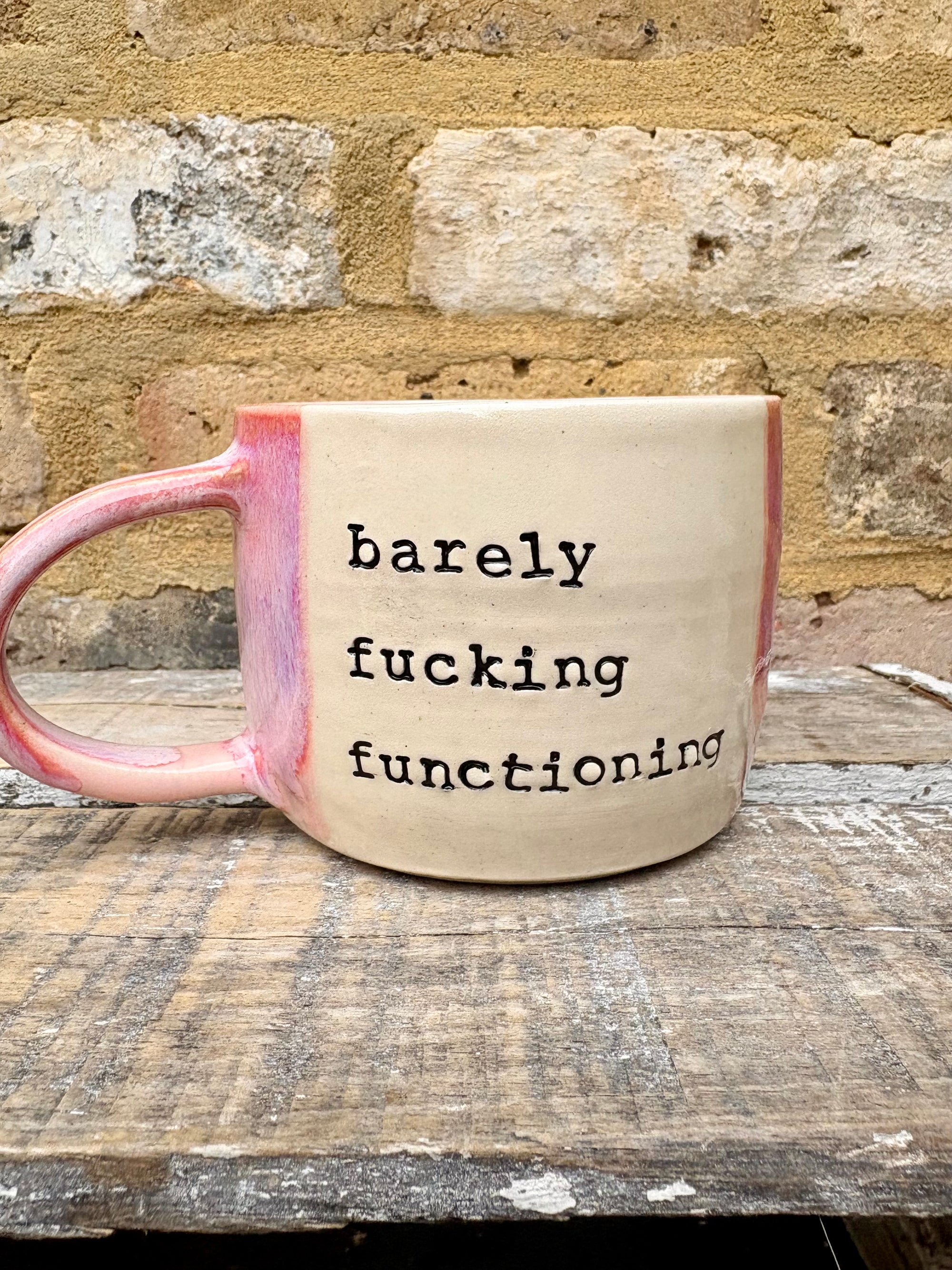 "barely fucking functioning" mug (pink)