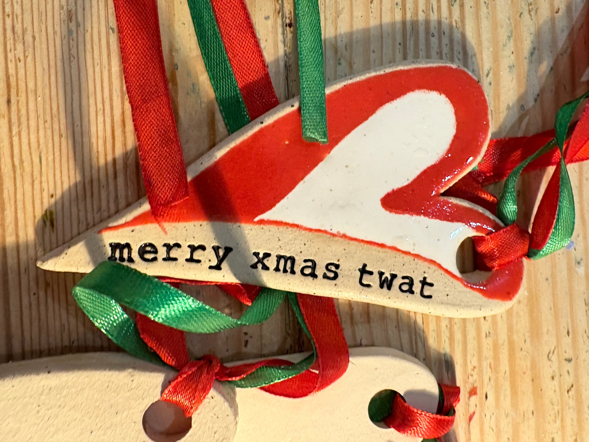 “merry xmas twat” hanging decoration (red and white, large)