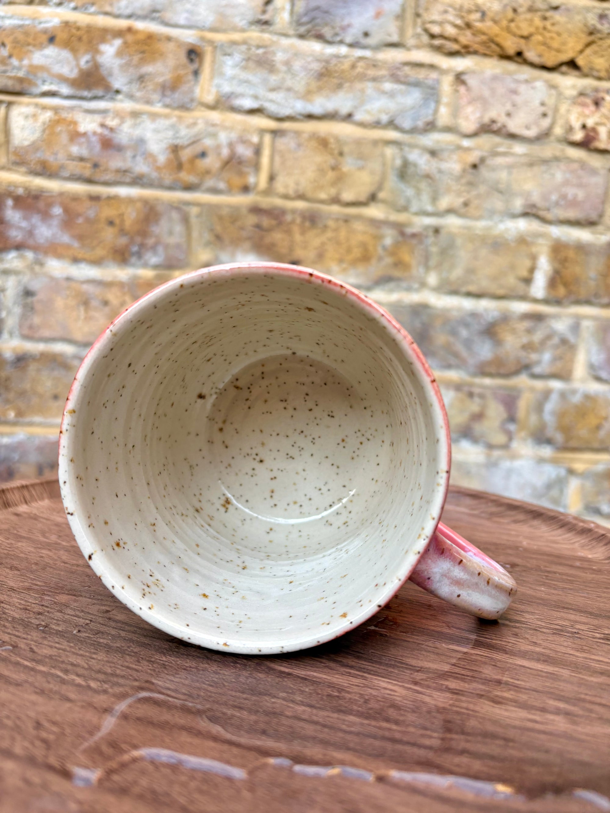 “FRAGILE (like a bomb) mug (pink, black text)