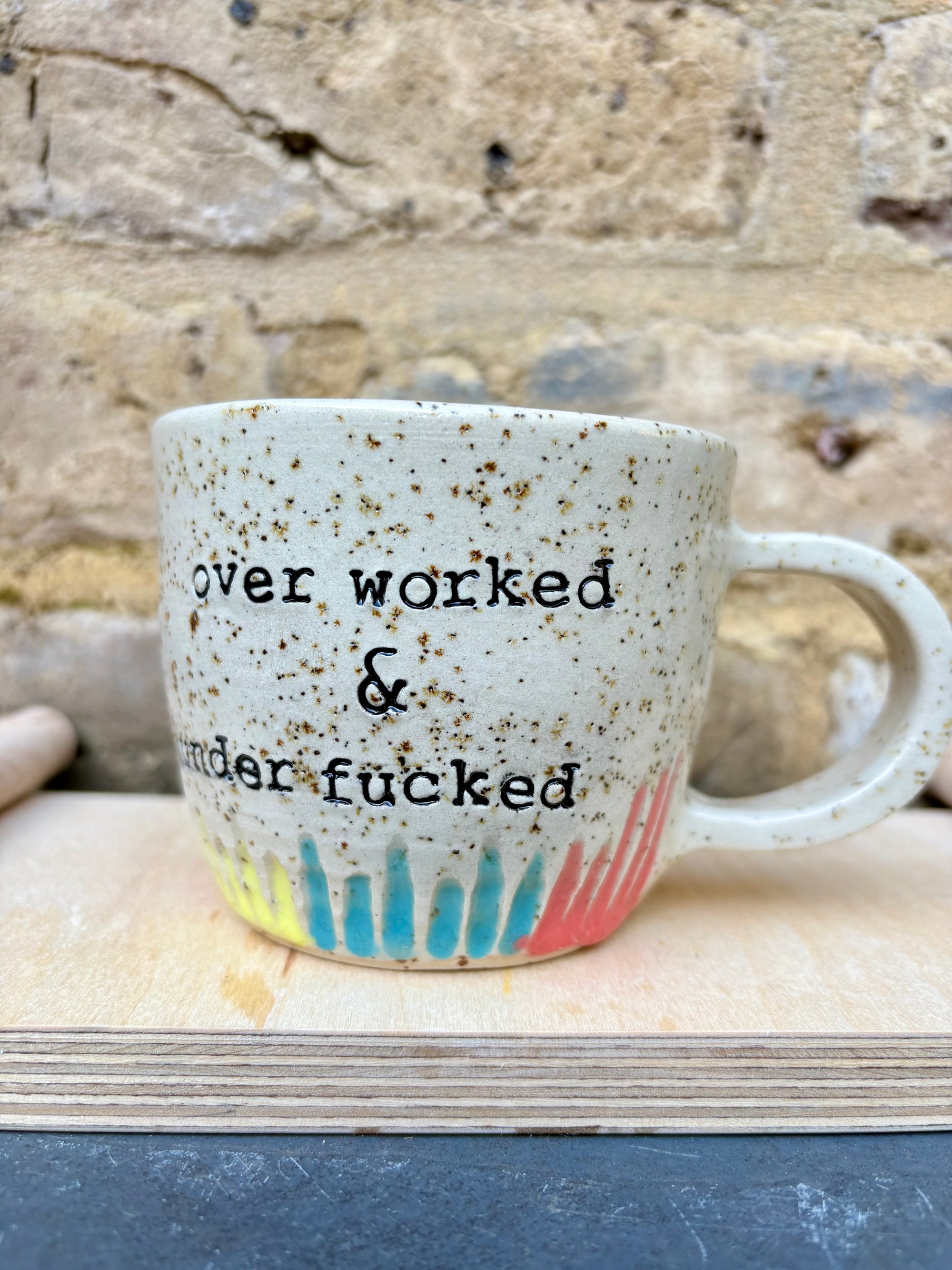 overworked and underfucked mug (multicoloured rainbow grooves)
