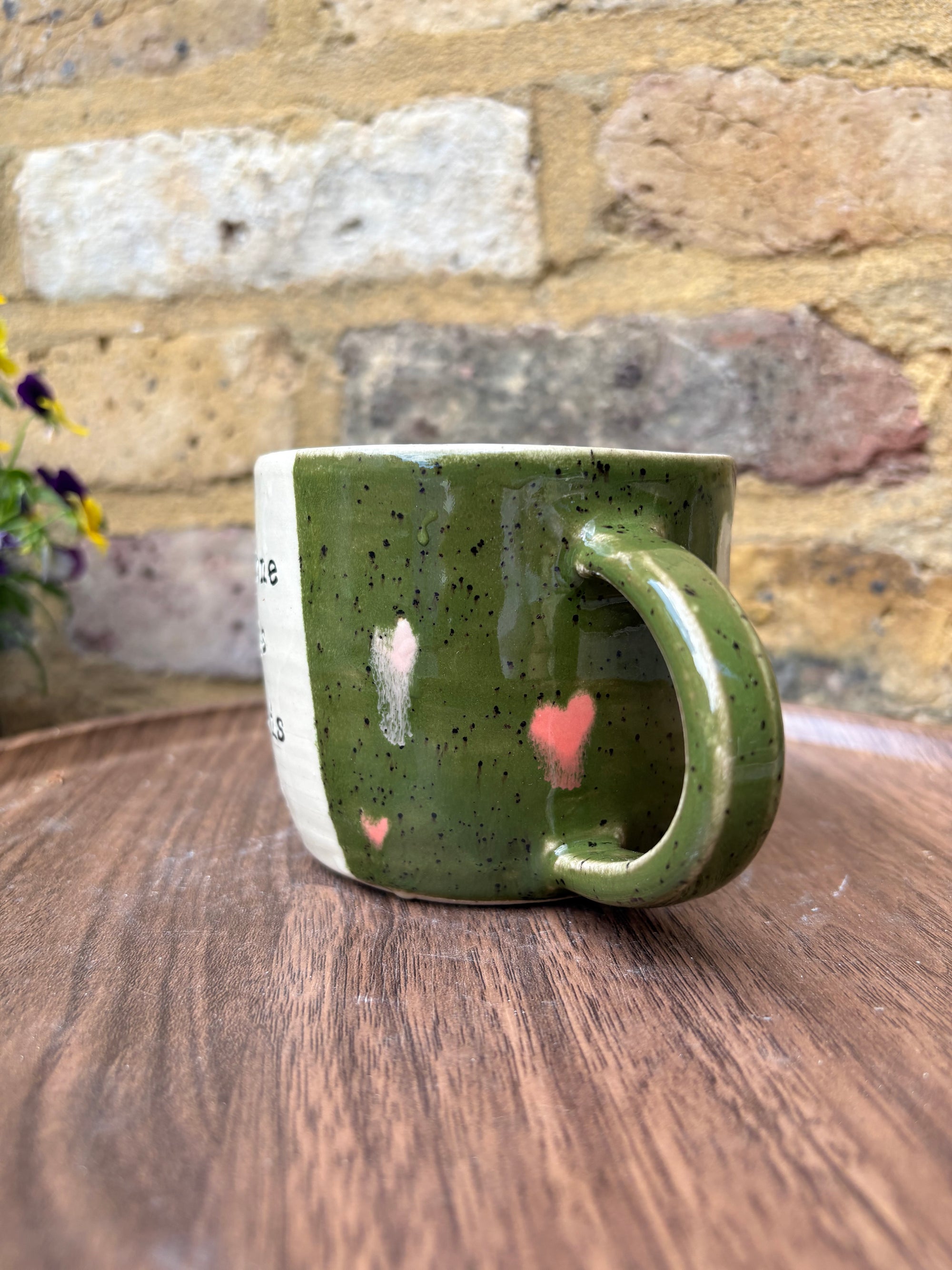 "I 🩷 WORK” "everyone in this place is a cunt" mug (green, right hander, pink hearts)