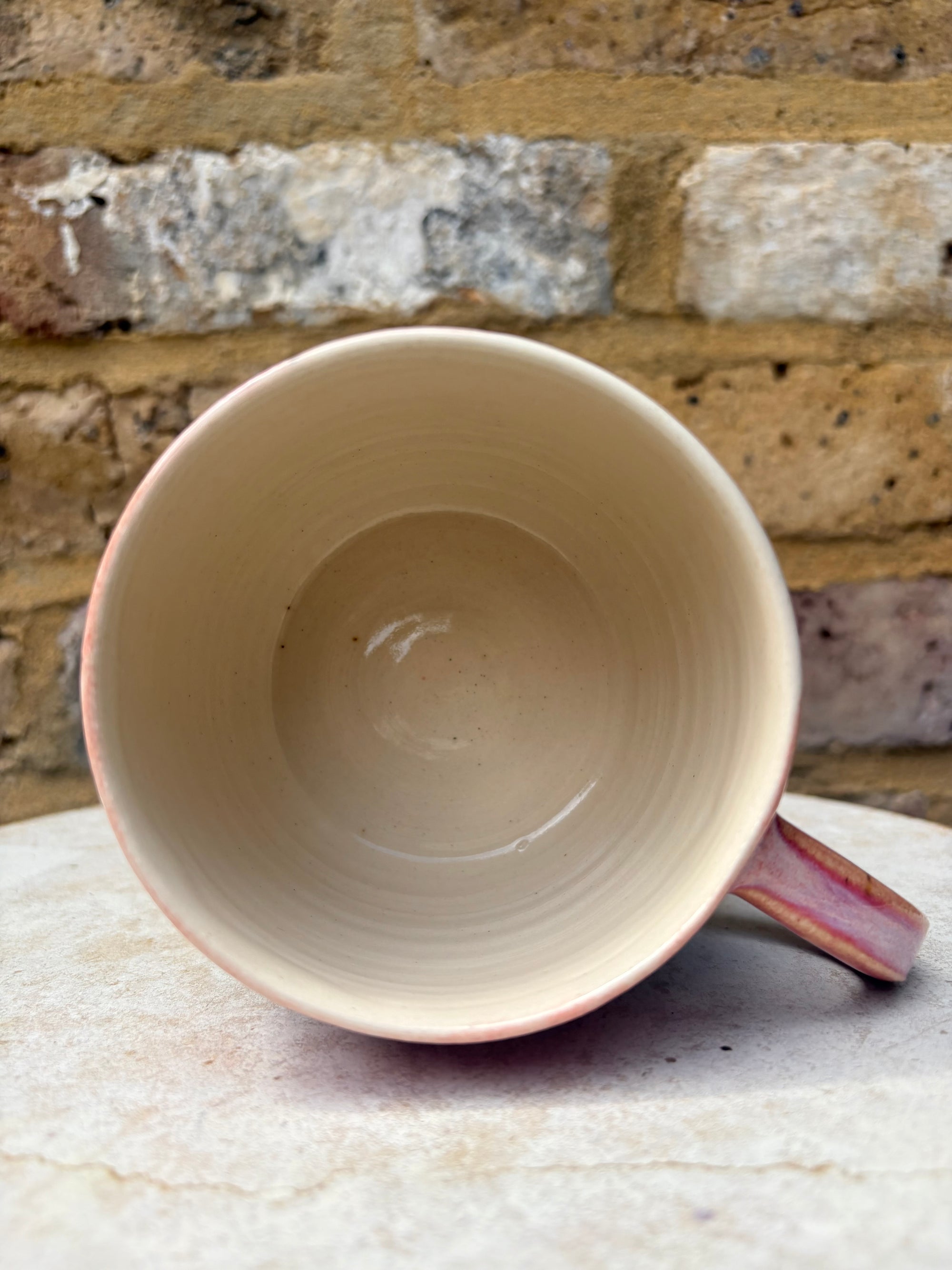 "please hesitate to reach out to me" mug (pink/green)