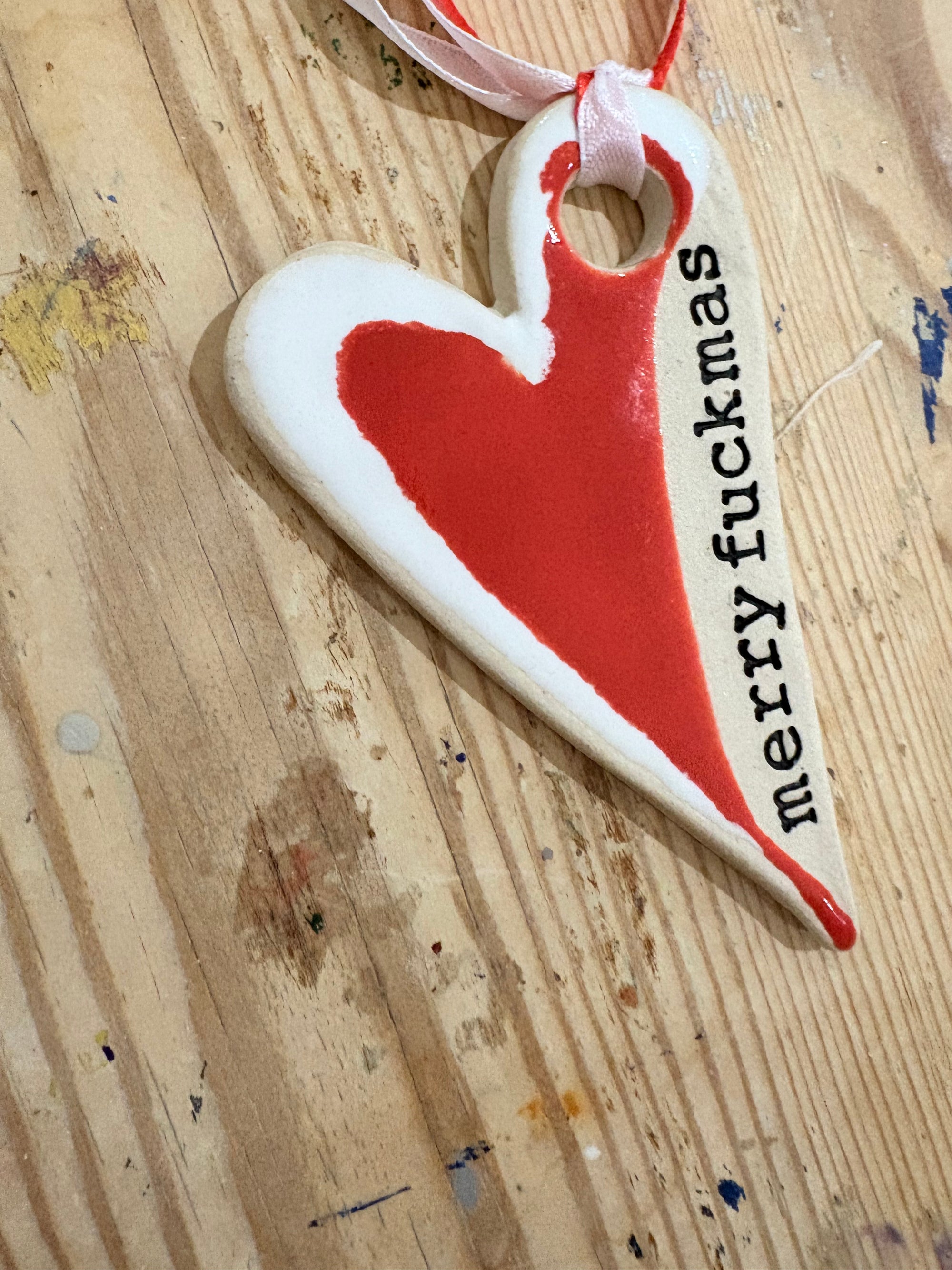 “merry fuckmas” hanging decoration (red and white, larger)