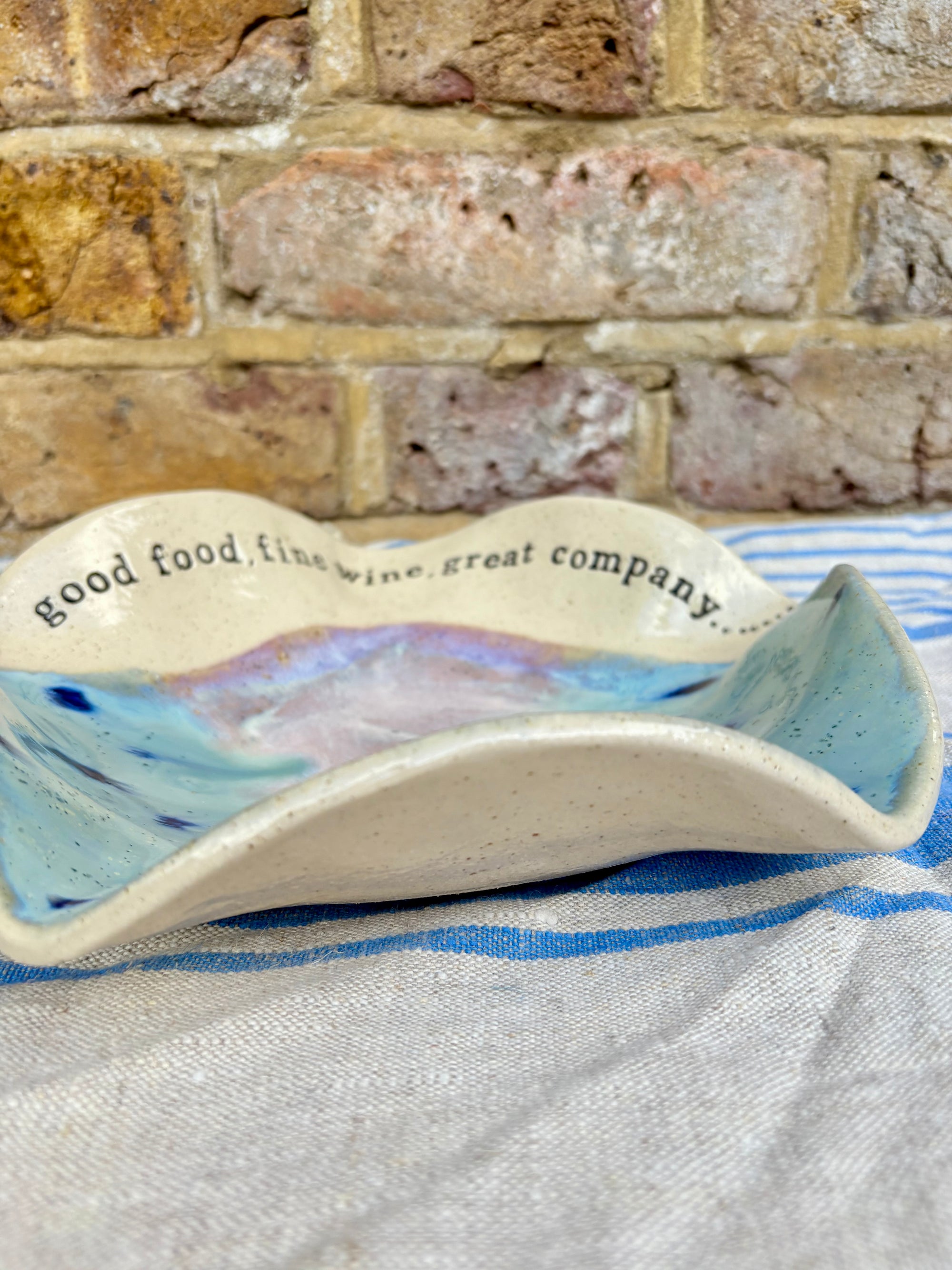 "good food, fine wine, great company..." serving dish