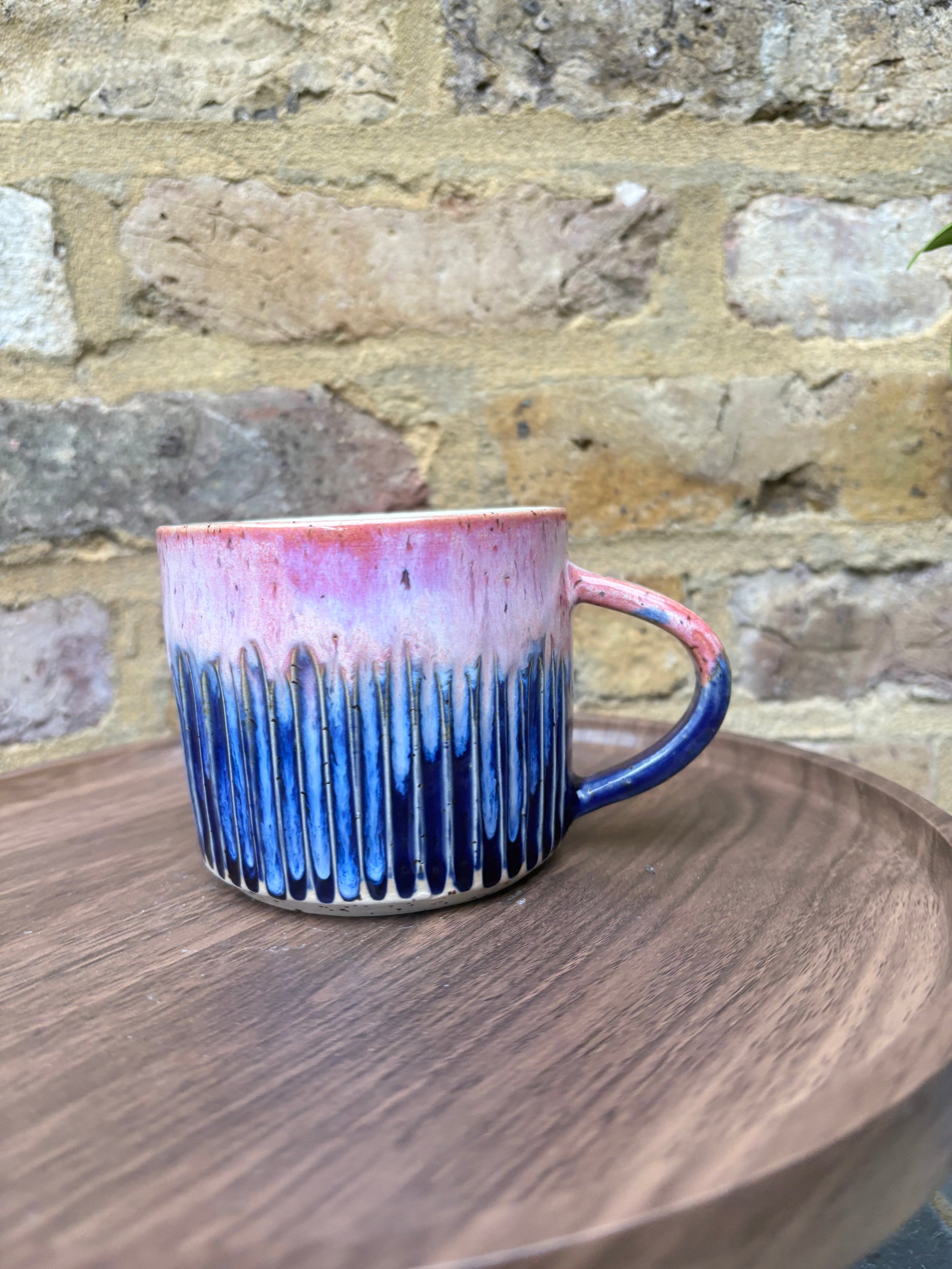 Large “A book a day keeps reality away" mug (pink sky)