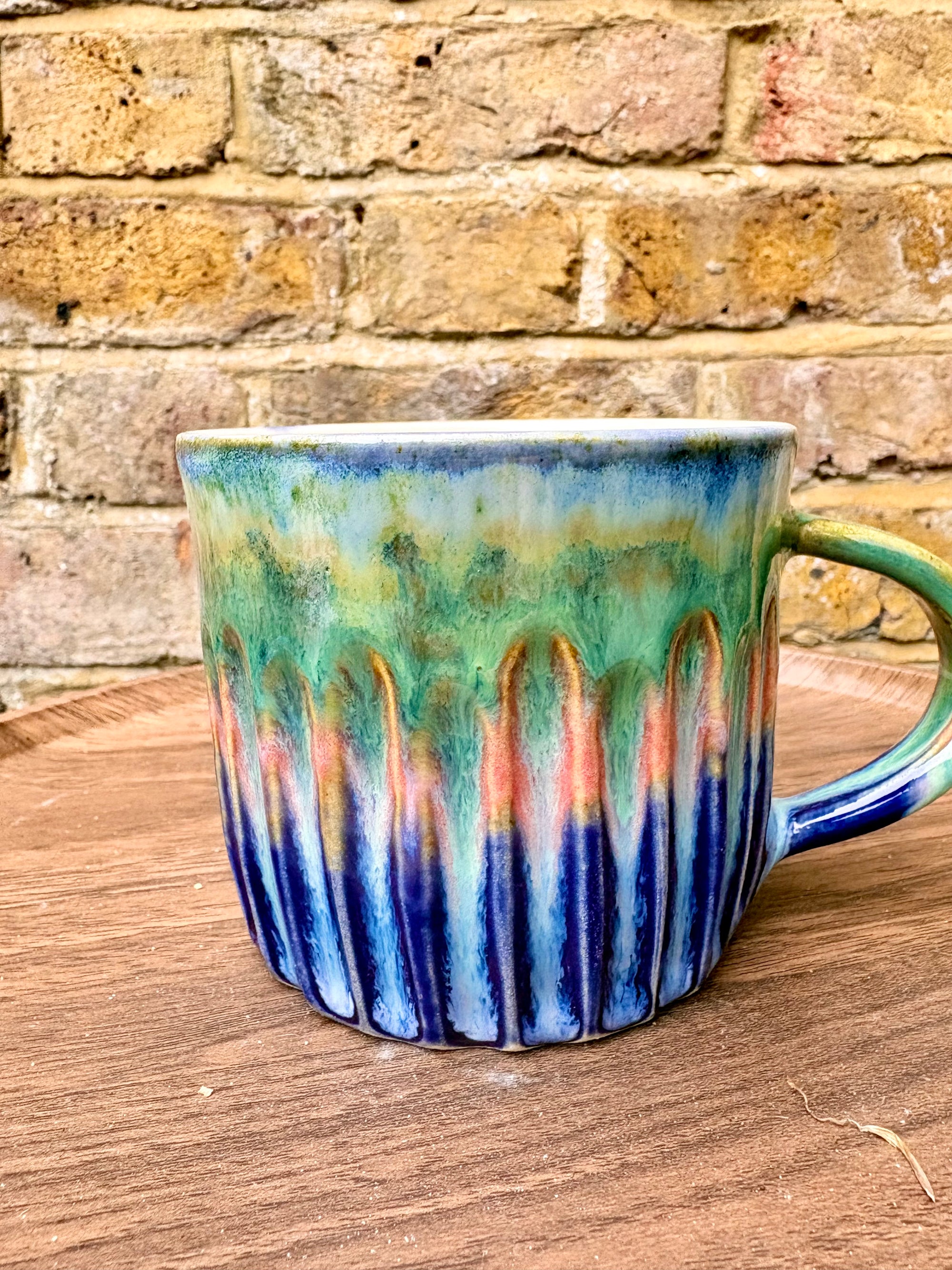 “Fuck off I’m reading" mug (greens/blues)