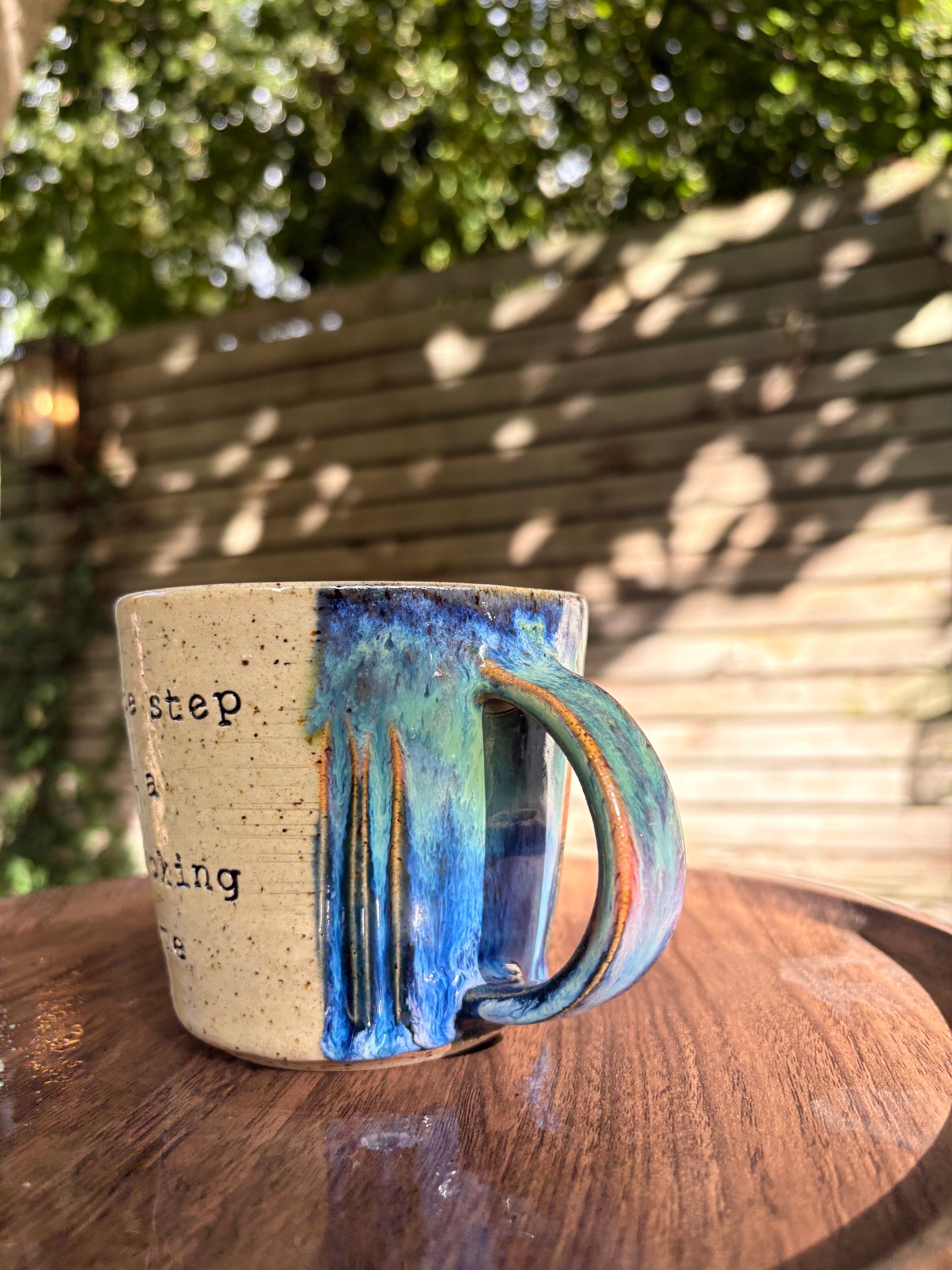 “one step at a fucking time" mug