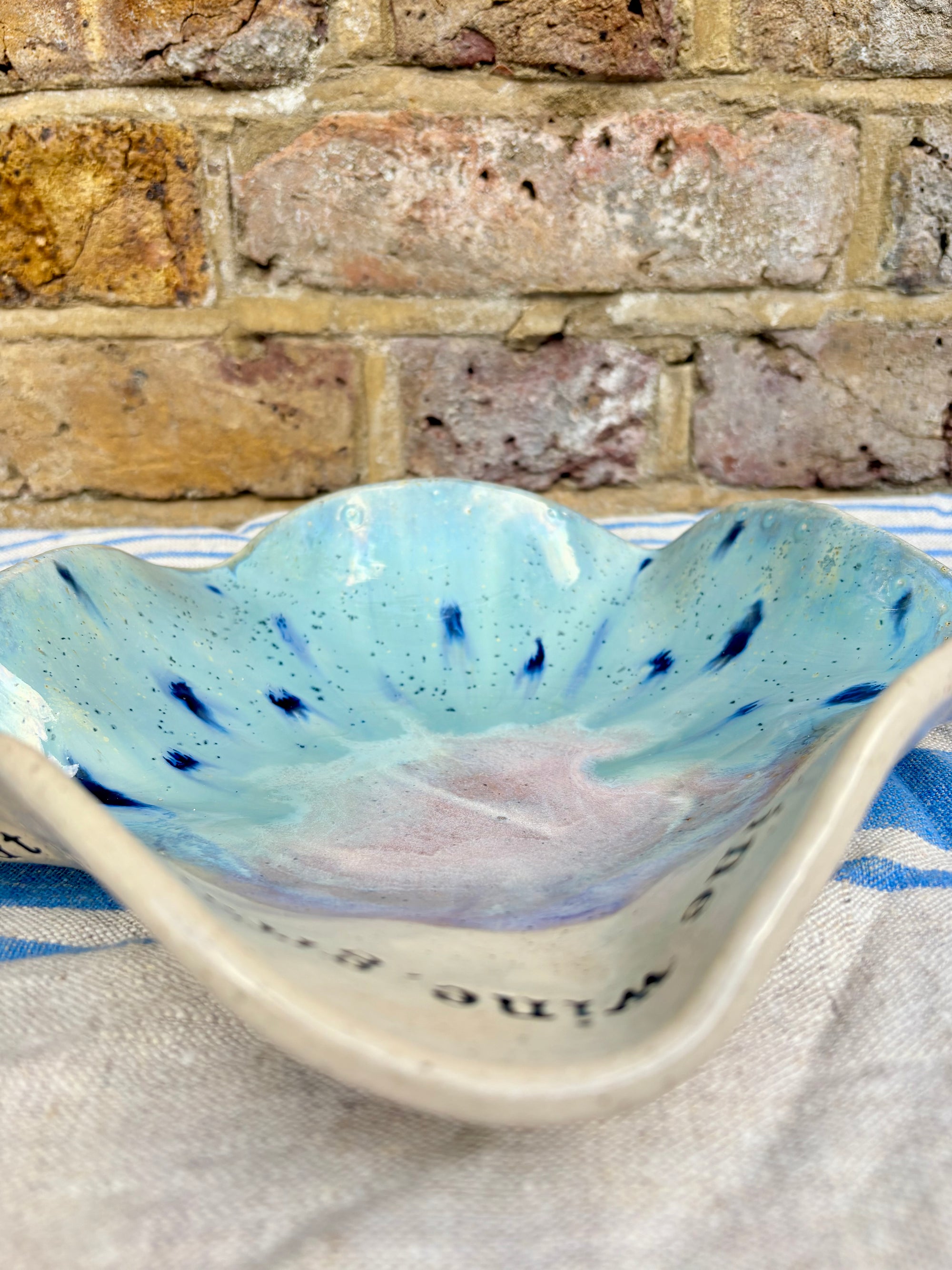 "good food, fine wine, great company..." serving dish