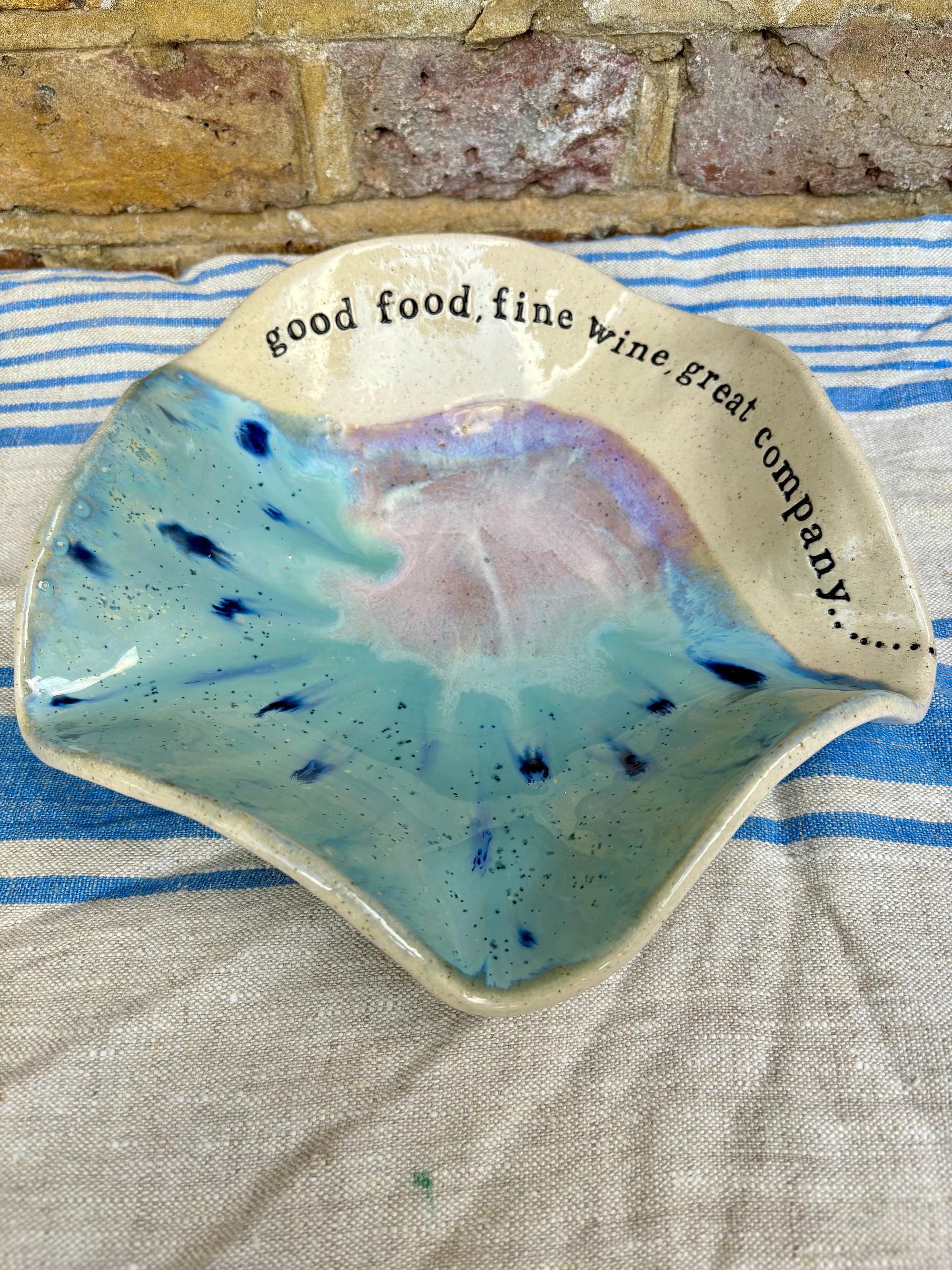 "good food, fine wine, great company..." serving dish