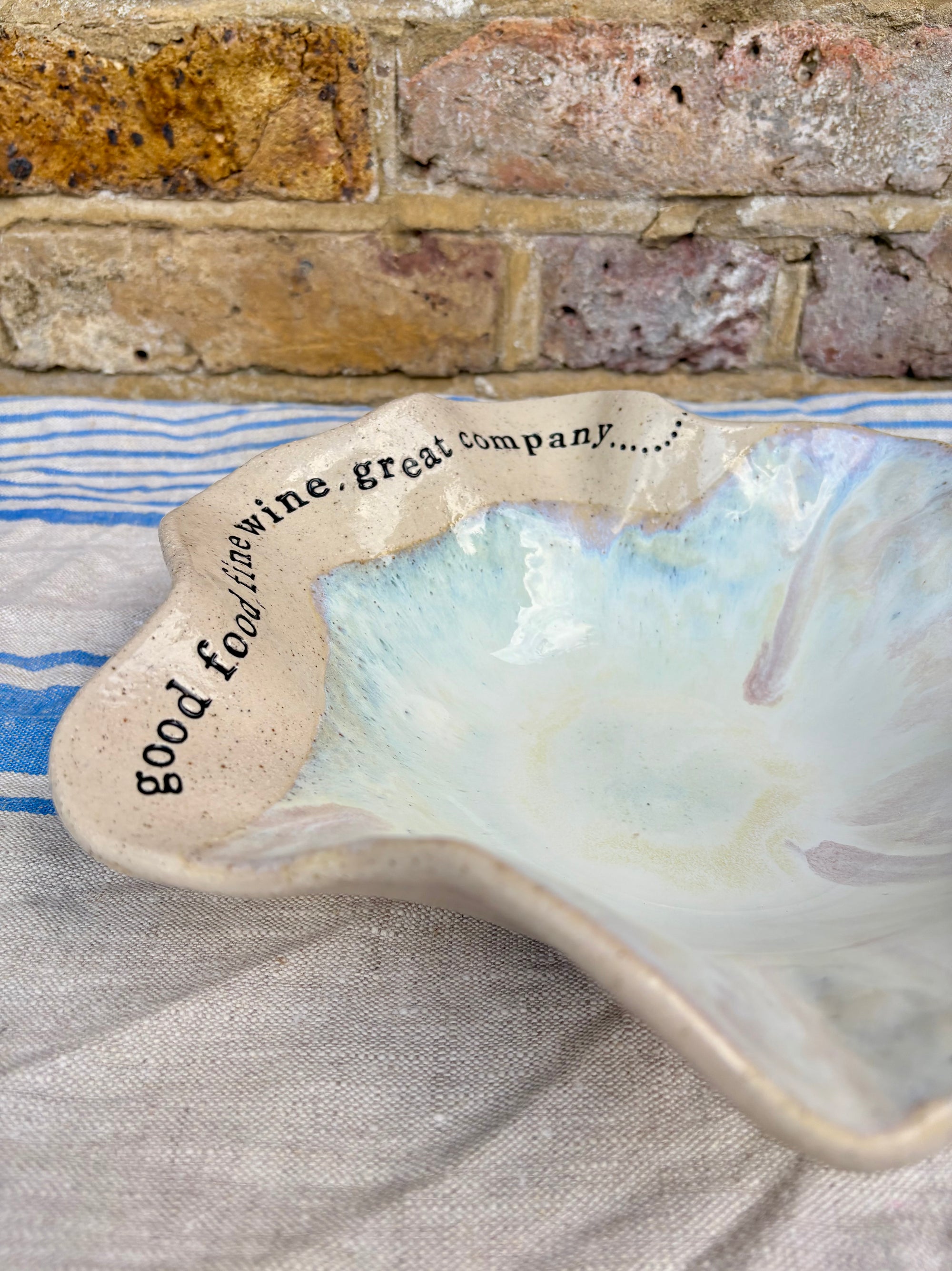 "good food, fine wine, great company..." serving dish