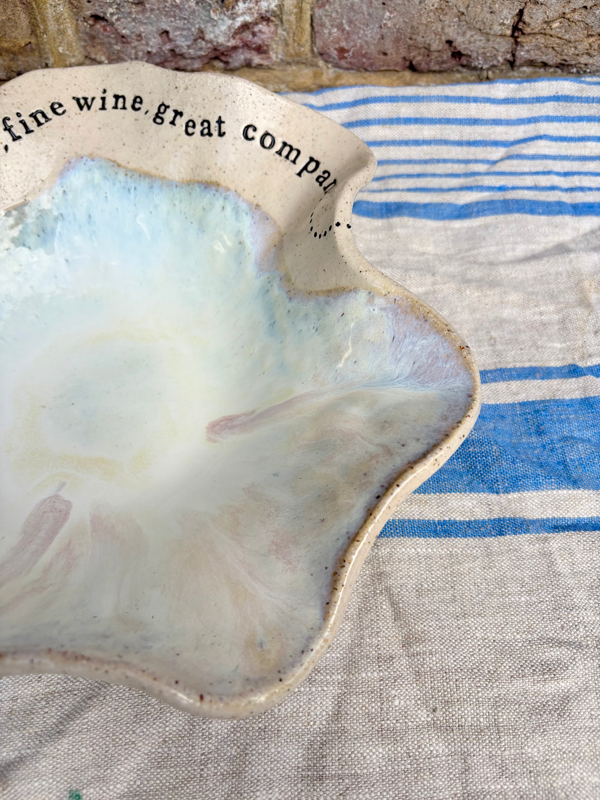 "good food, fine wine, great company..." serving dish