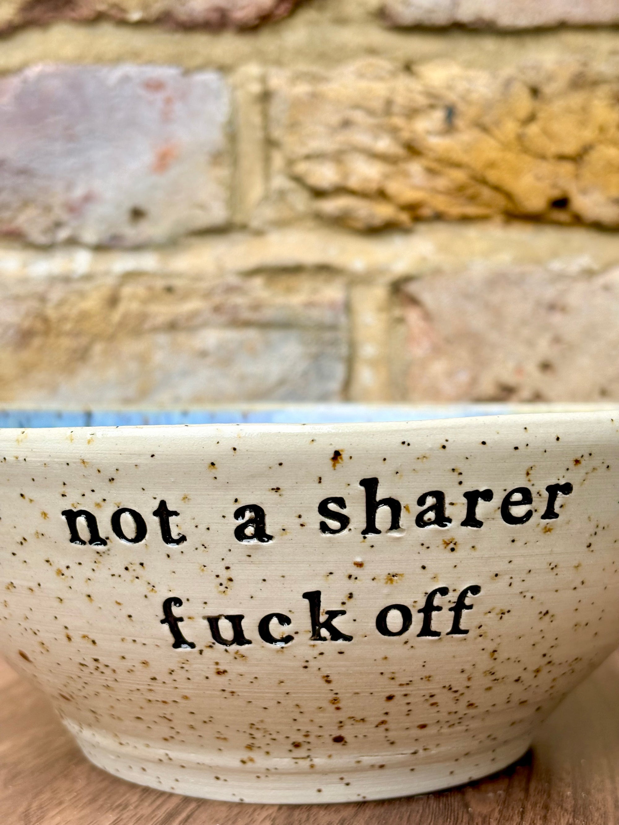 “not a sharer fuck off” deep round cereal bowl (blue, flecked clay)