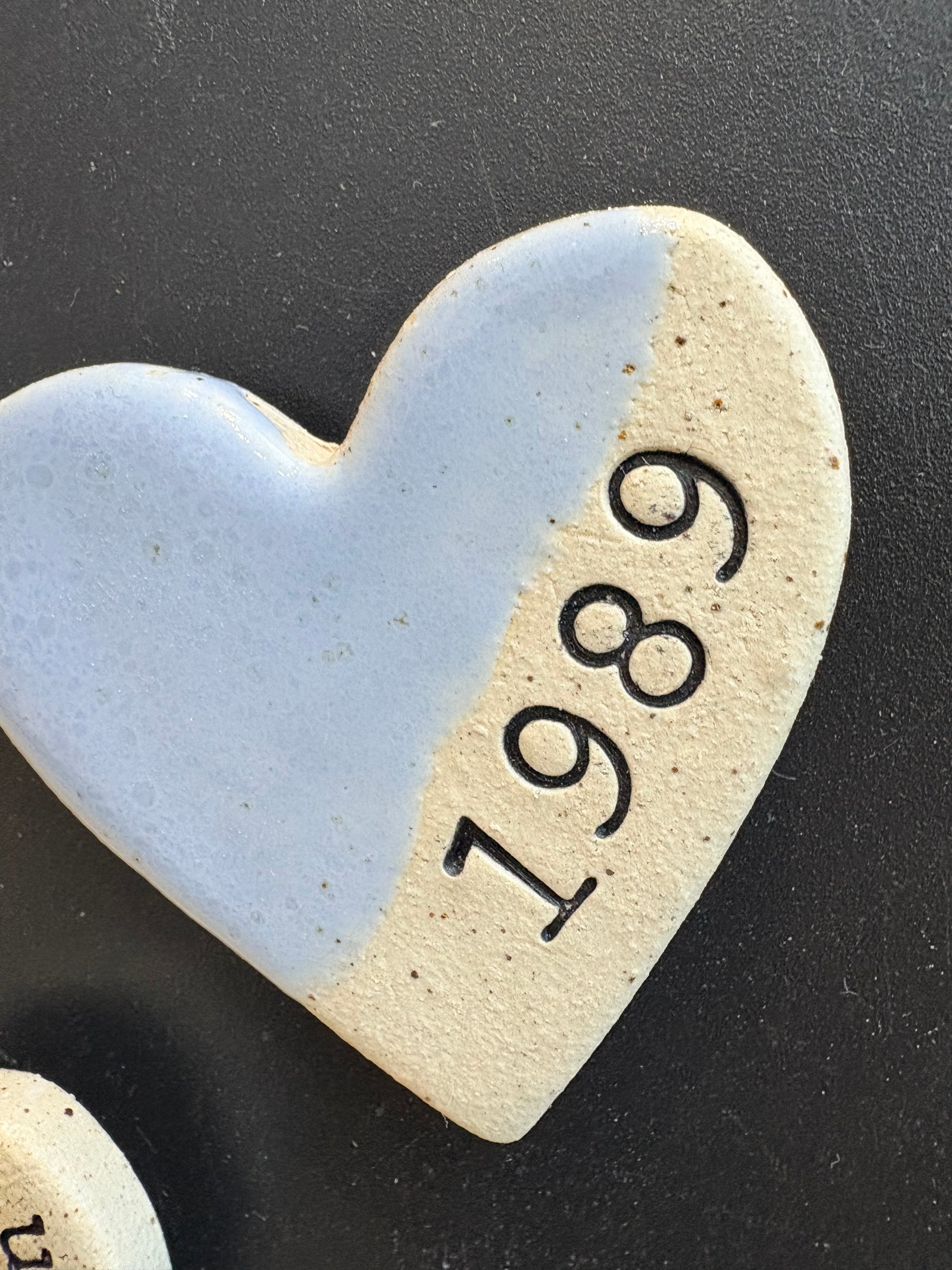 Twelve heart shaped Taylor Swift album magnets