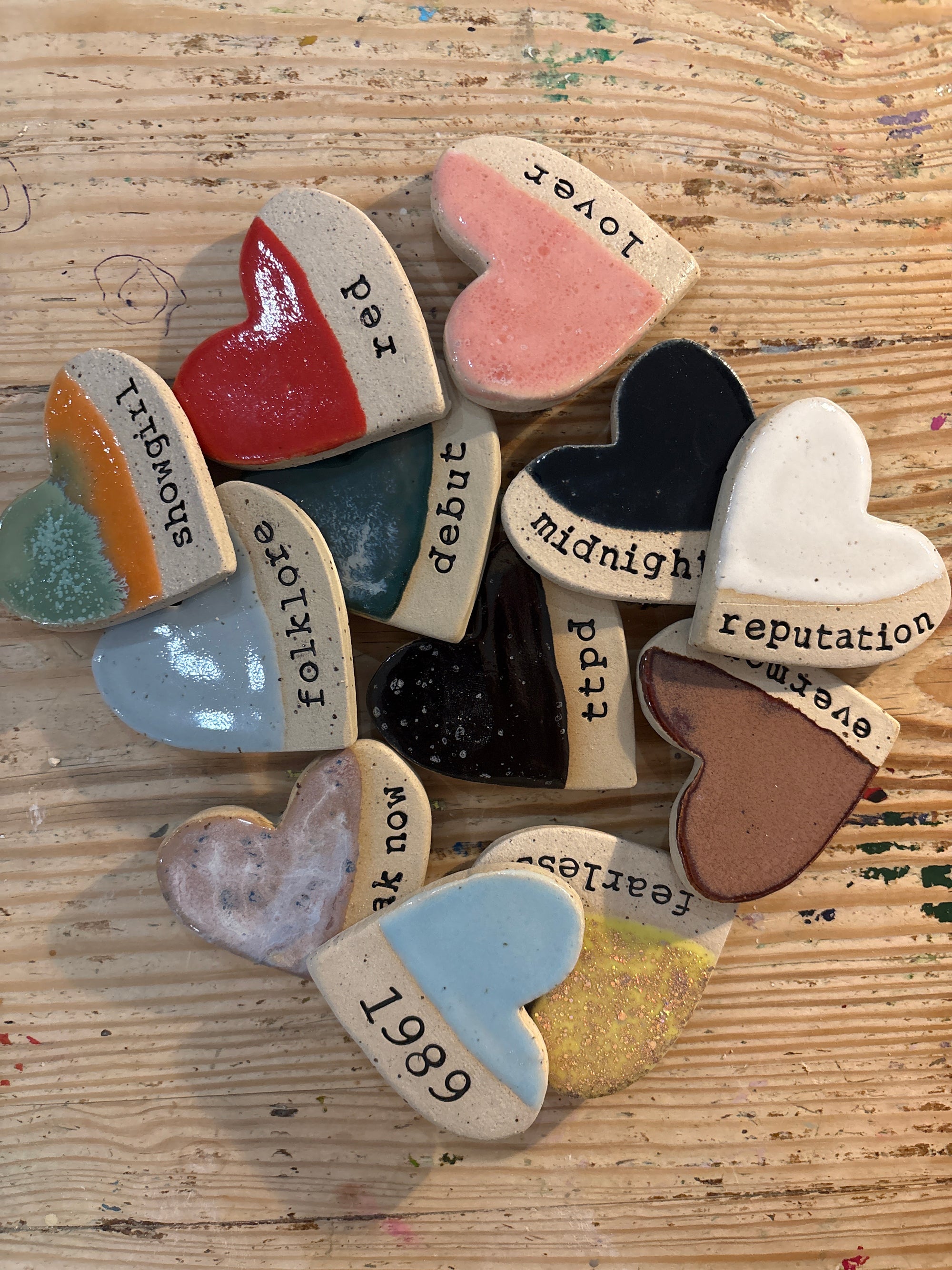 Twelve heart shaped Taylor Swift album magnets
