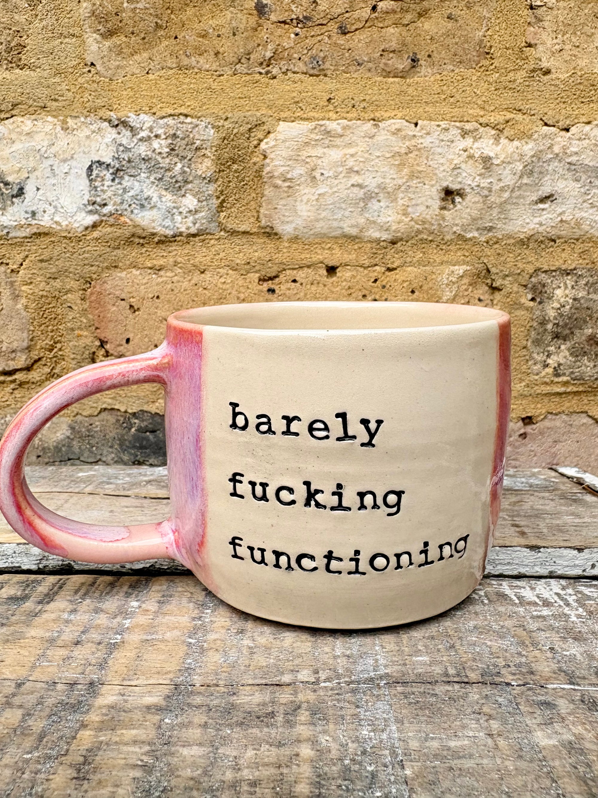 "barely fucking functioning" mug (pink)