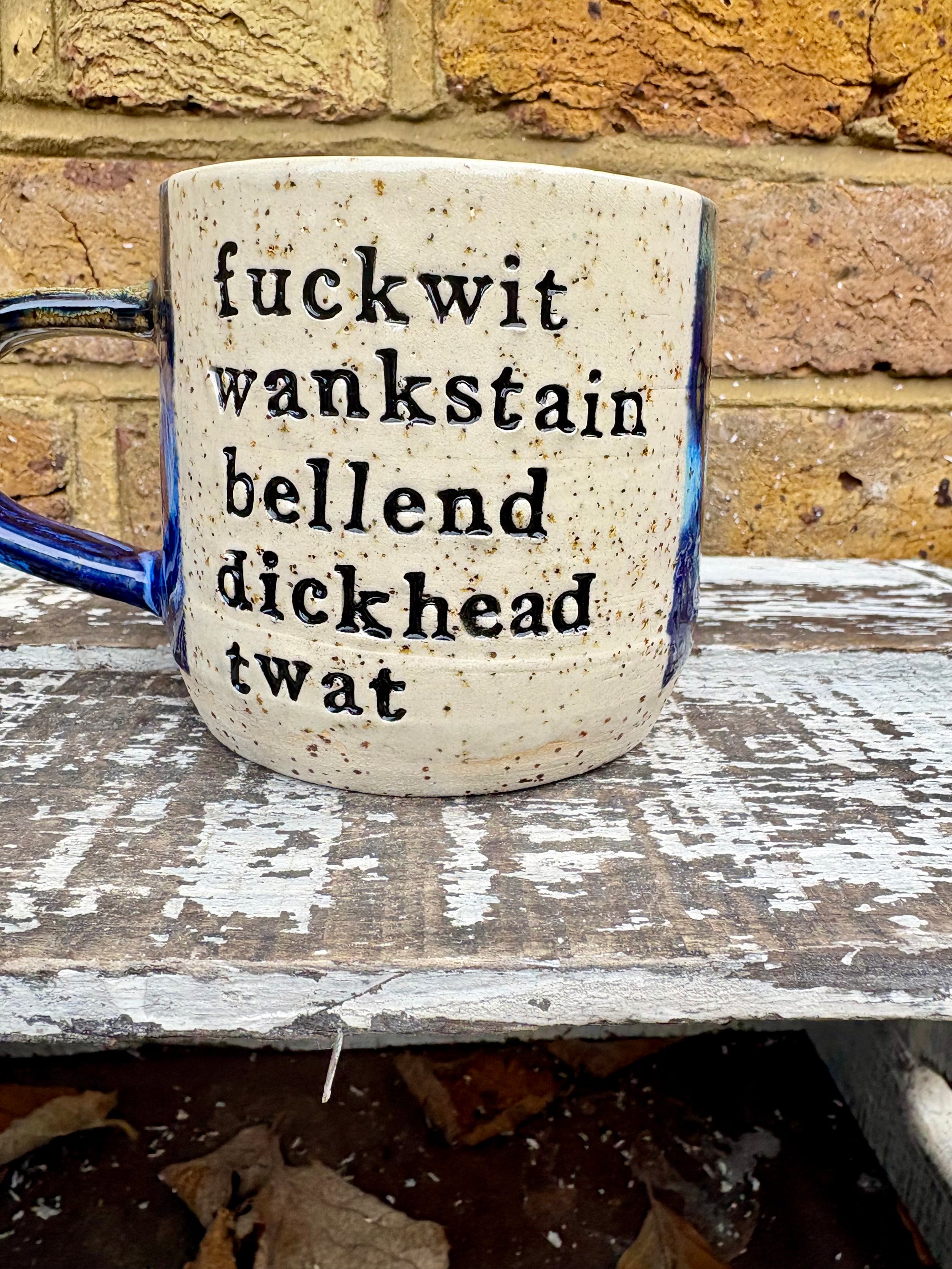 "bellend fuckwit dickwad dipshit wanker" mug (Antique Blues)