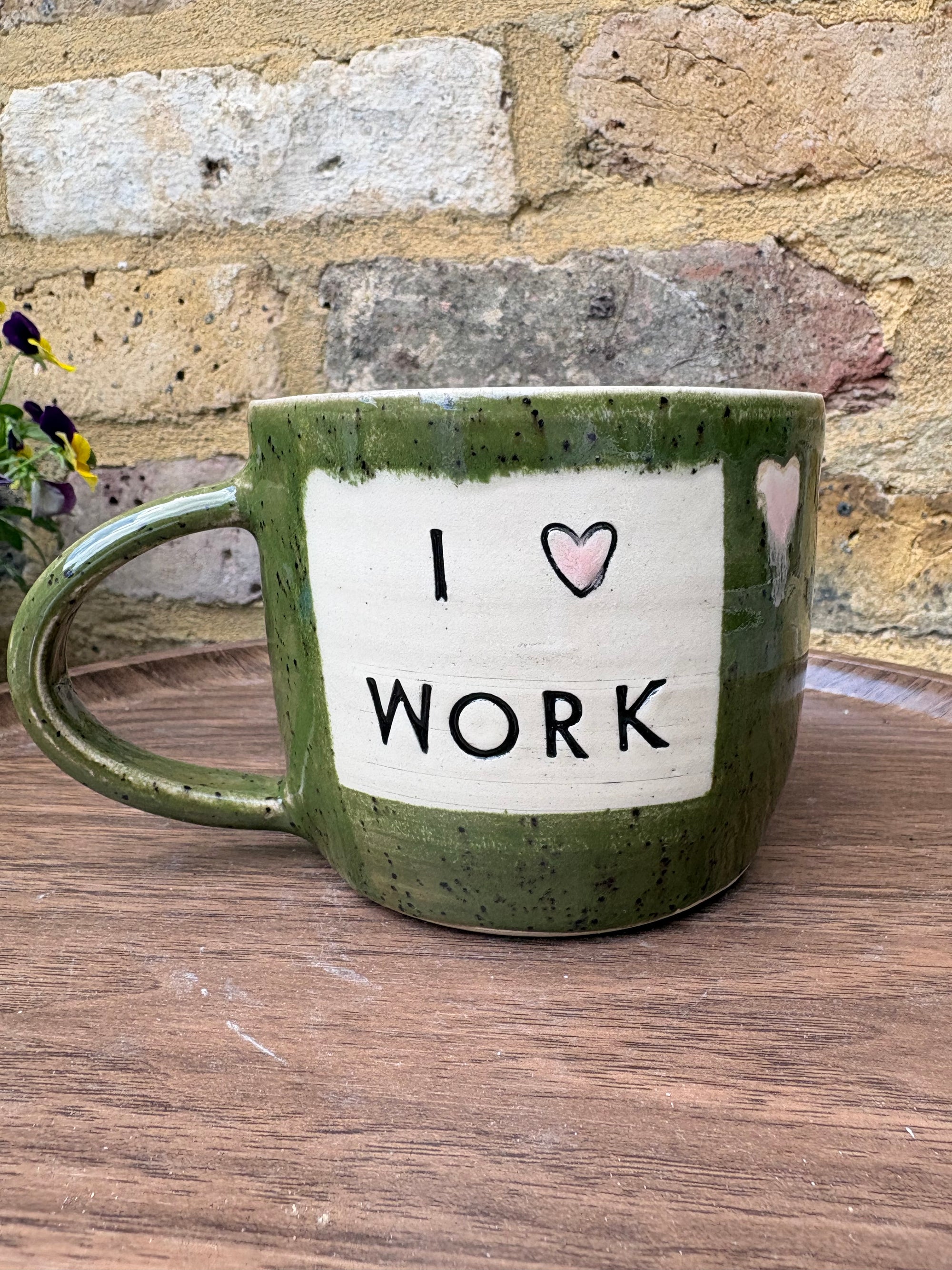 "I 🩷 WORK” "everyone in this place is a cunt" mug (green, right hander, pink hearts)