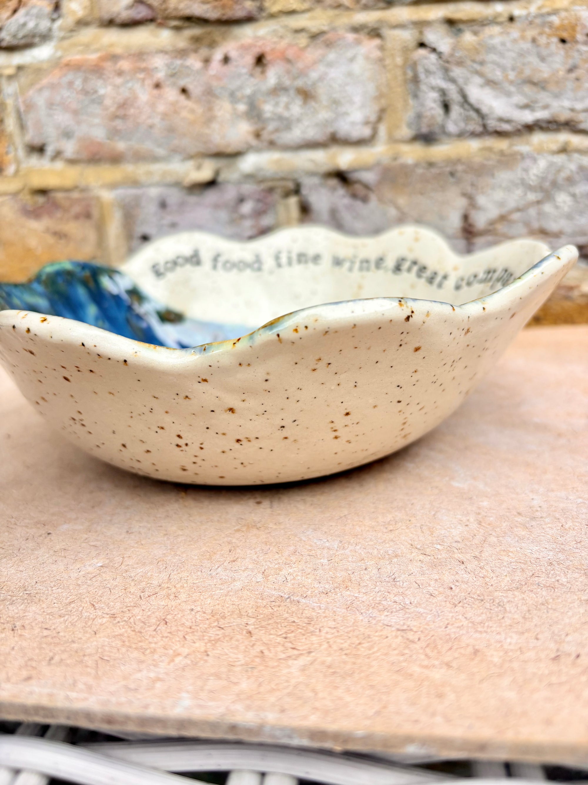 "good food, fine wine, great company..." deep salad/serving dish