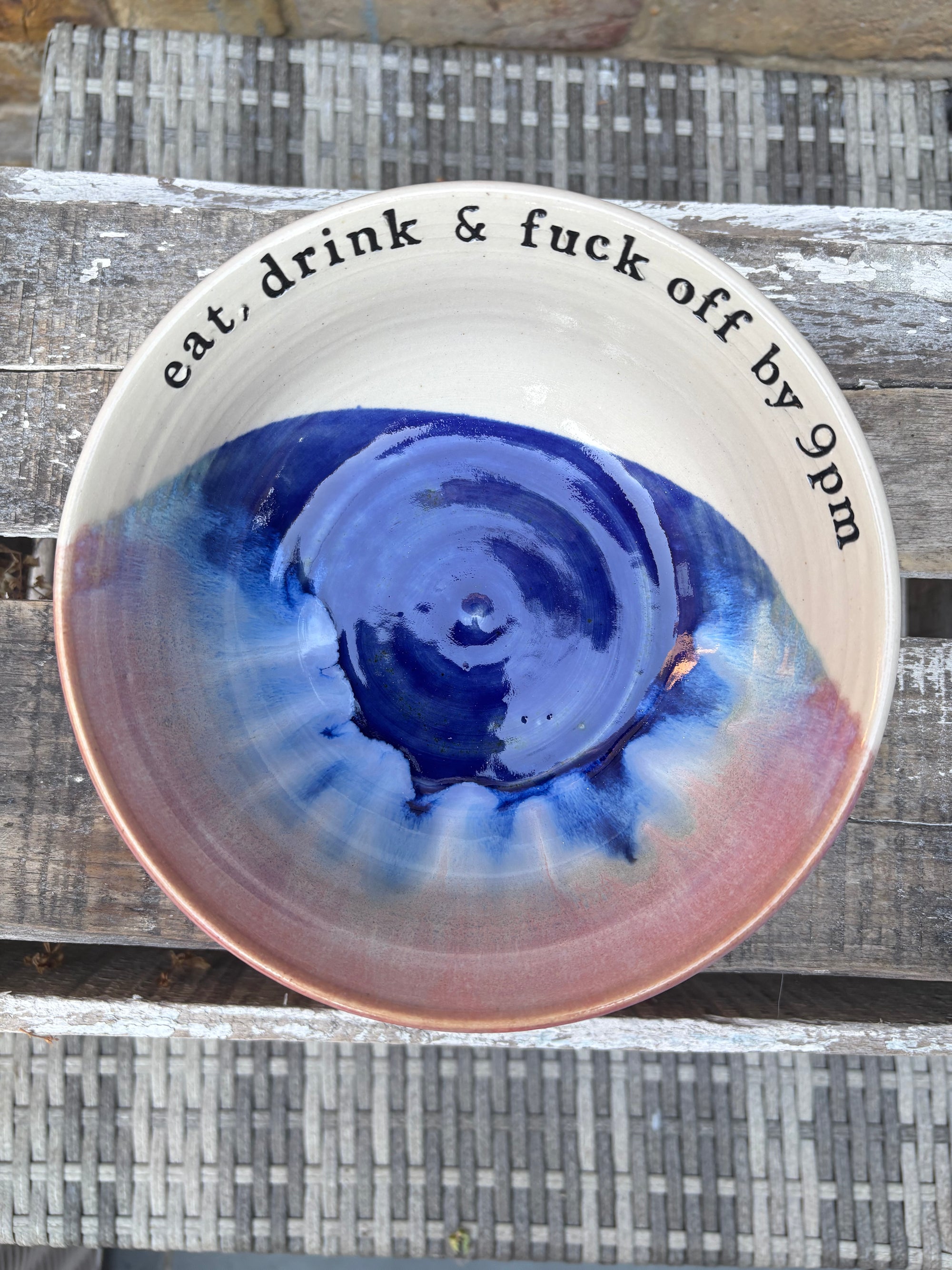 “eat, drink and fuck off by 9pm"  deep round salad/pasta bowl (pink night sky)