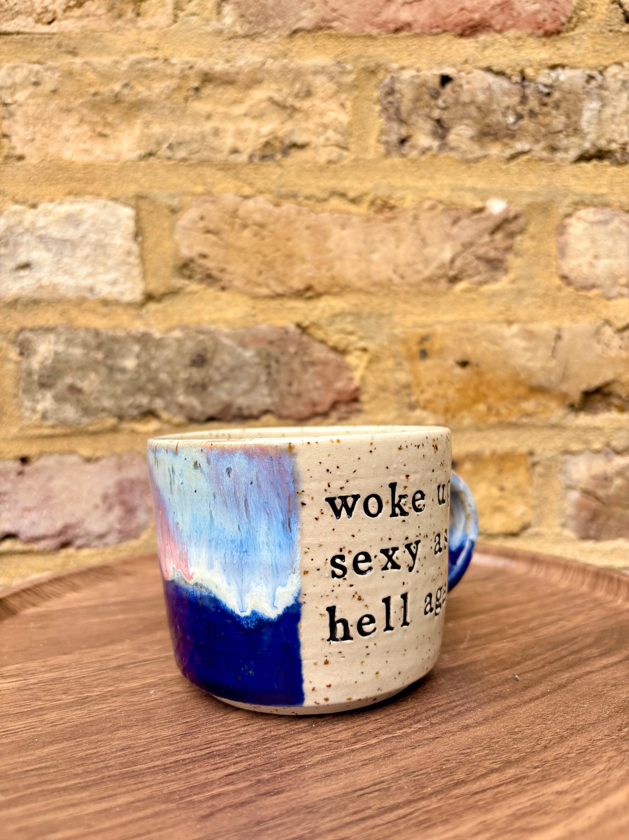 “woke up sexy as hell again” mug (flecked, pink night sky)