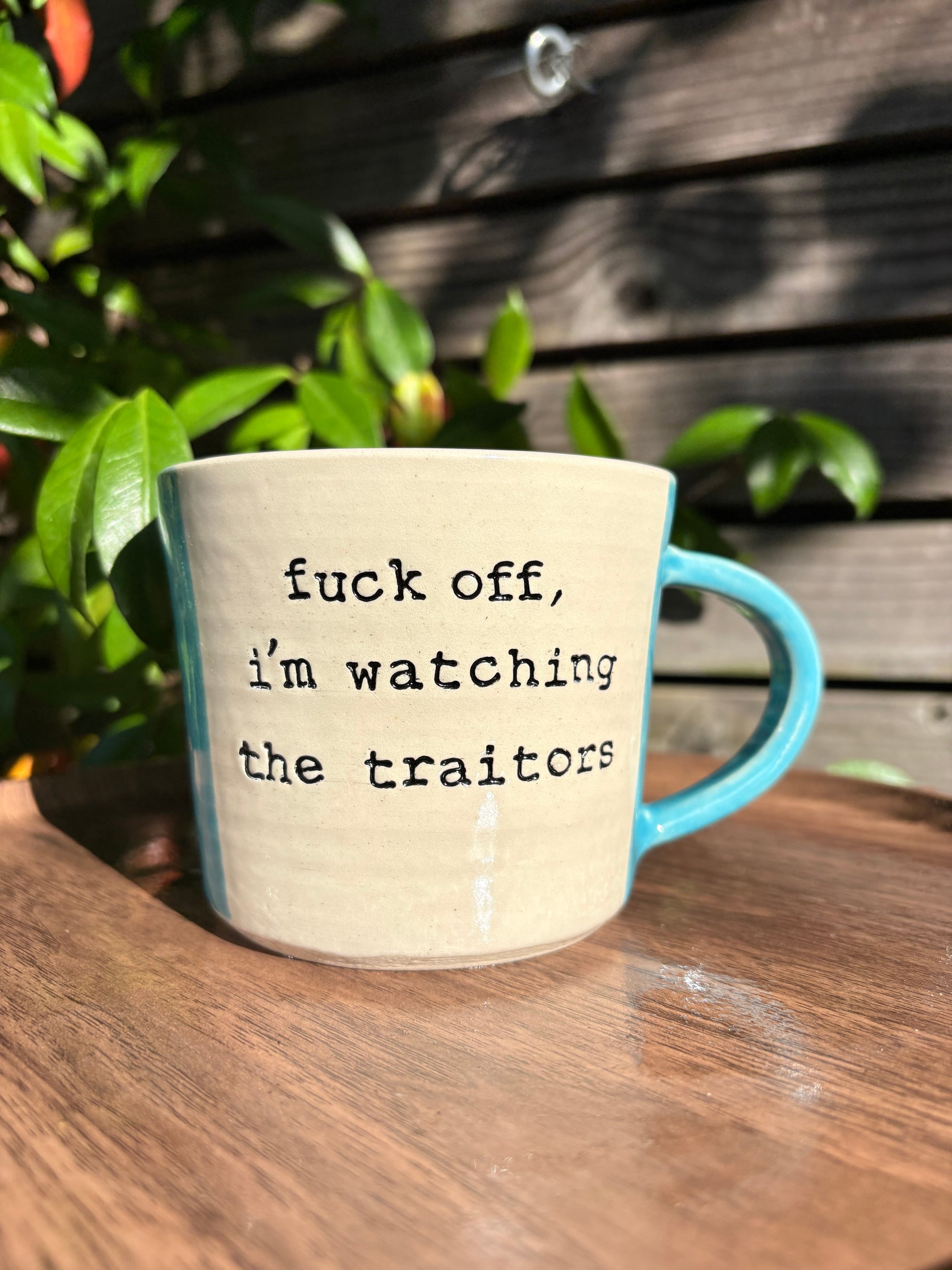 "fuck off, i'm watching the traitors" mug (handle/light blue, 330ml)