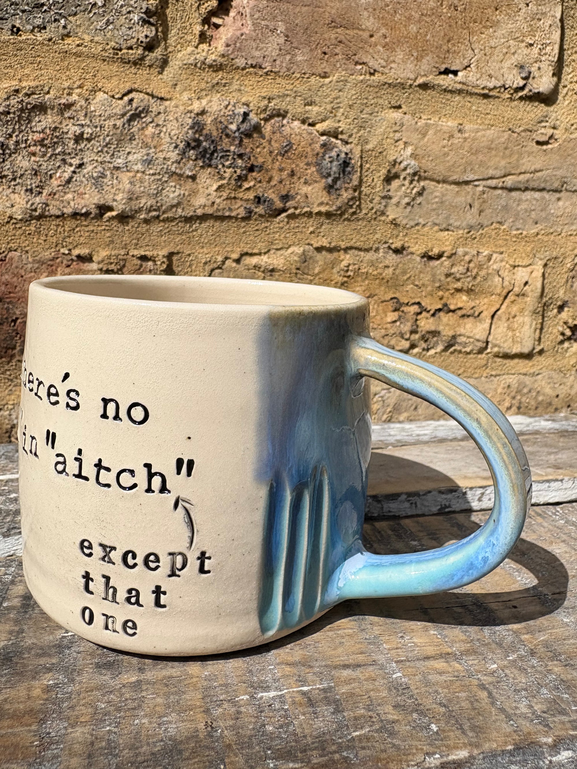 ""there's no "h" in "aitch" except that one" mug (blues)