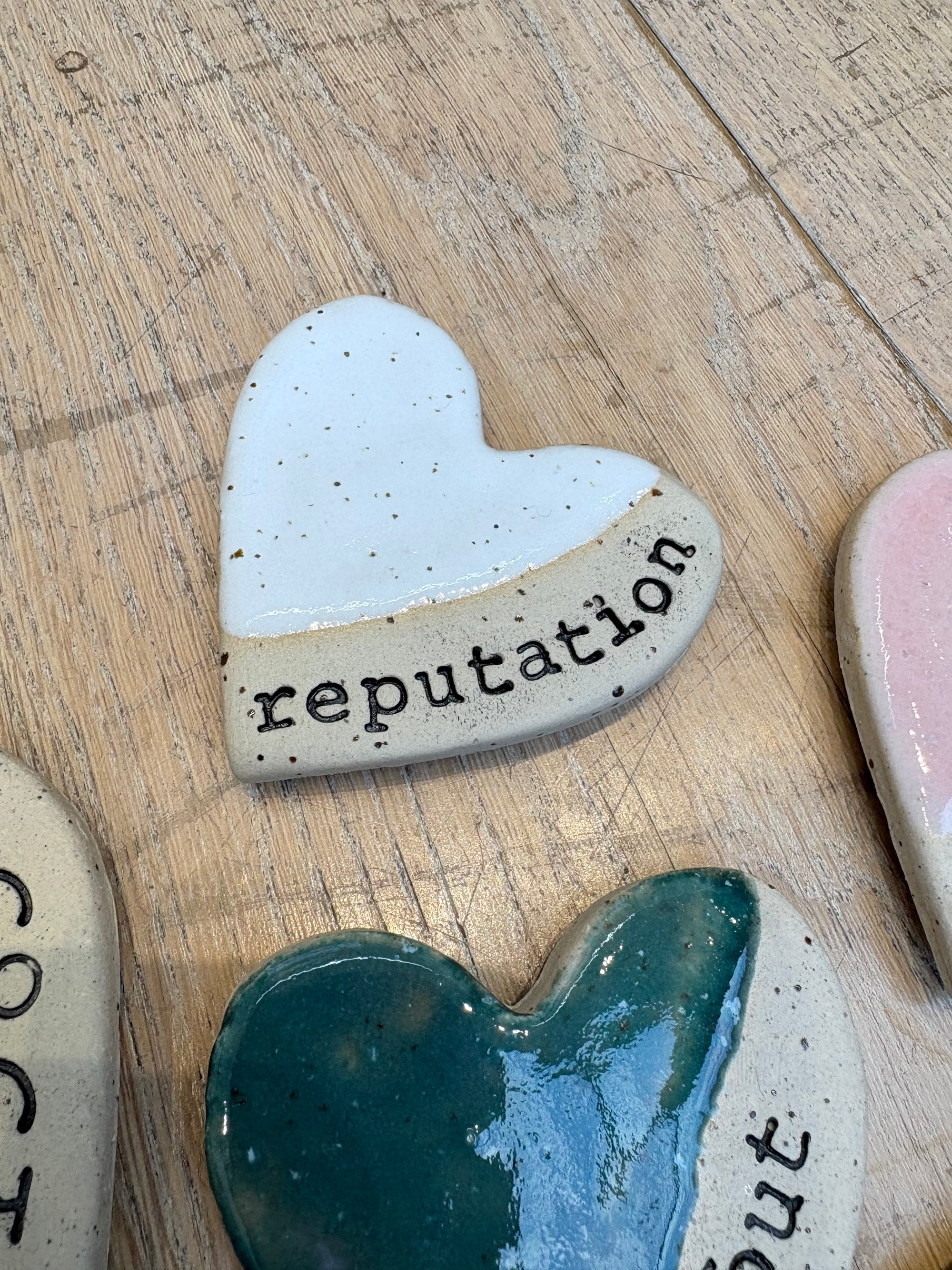 Twelve heart shaped Taylor Swift album magnets