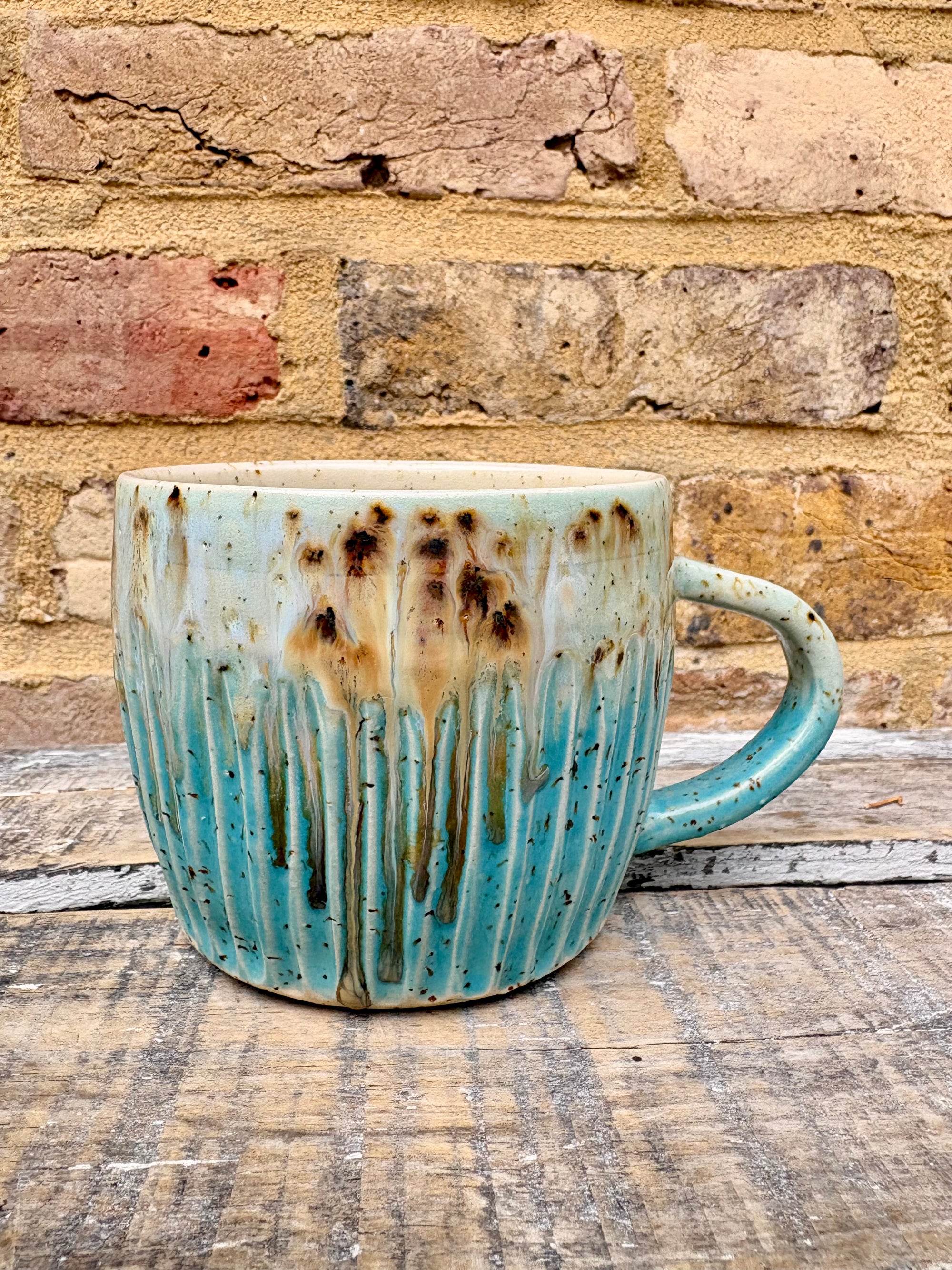 “A book a day keeps reality away" mug (turquoise)