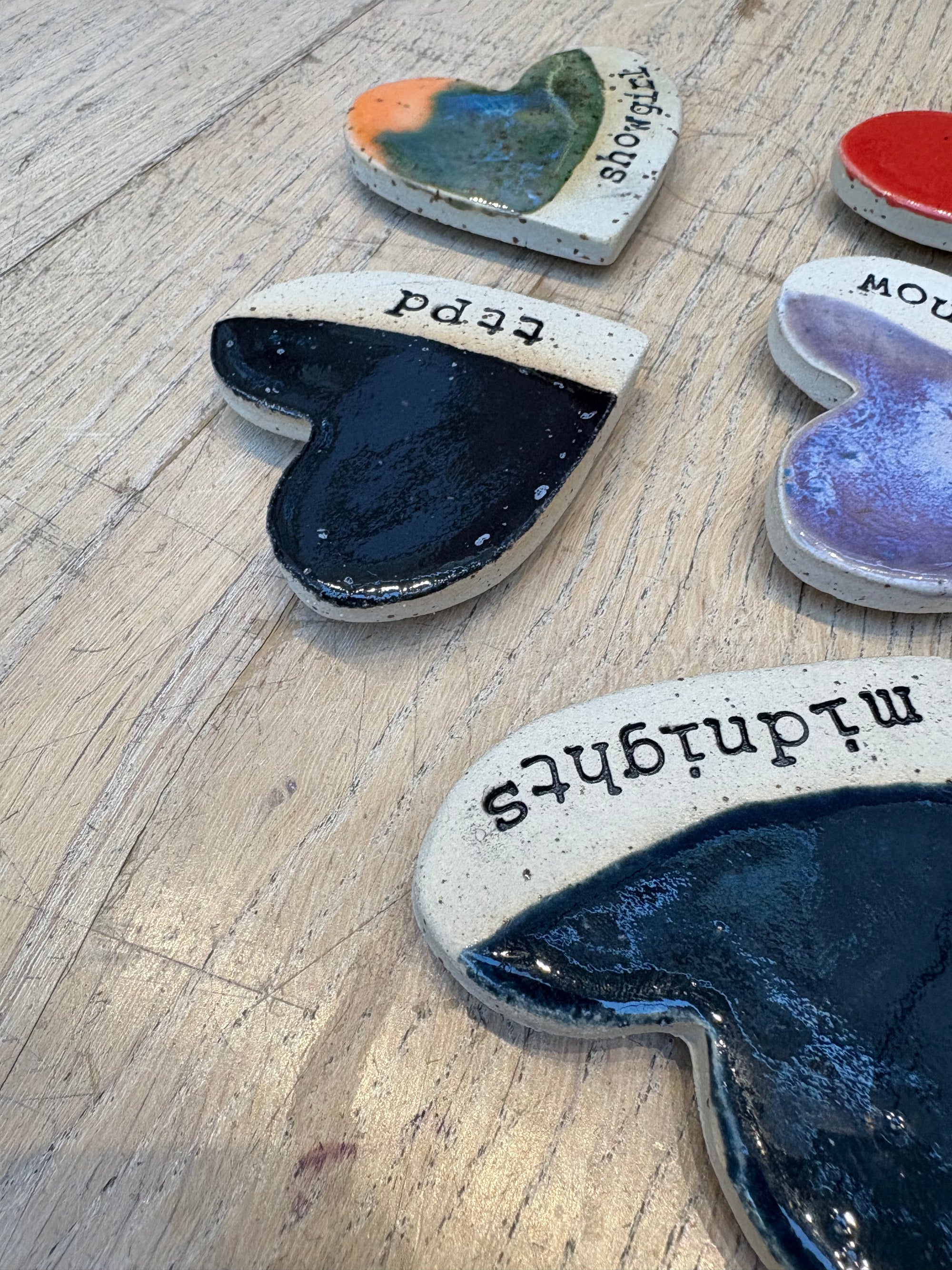 Twelve heart shaped Taylor Swift album magnets