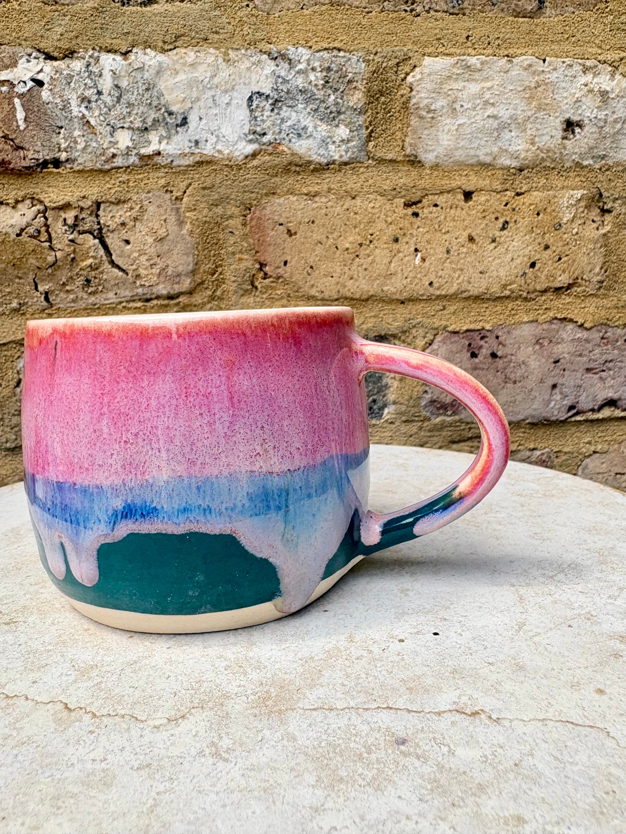 "please hesitate to reach out to me" mug (pink/green)