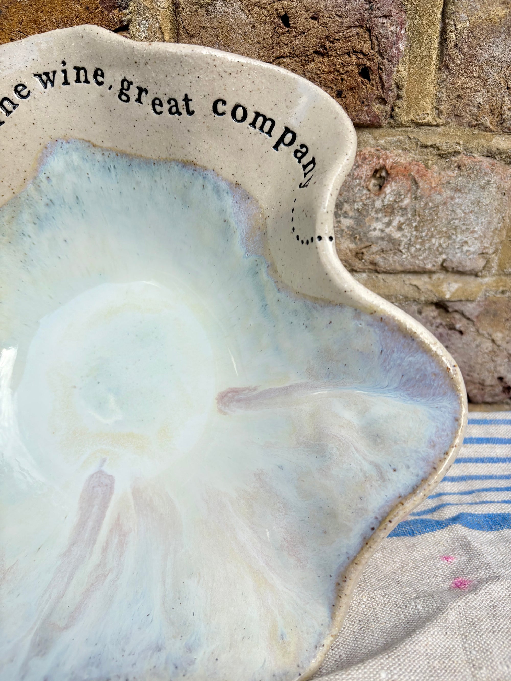 "good food, fine wine, great company..." serving dish